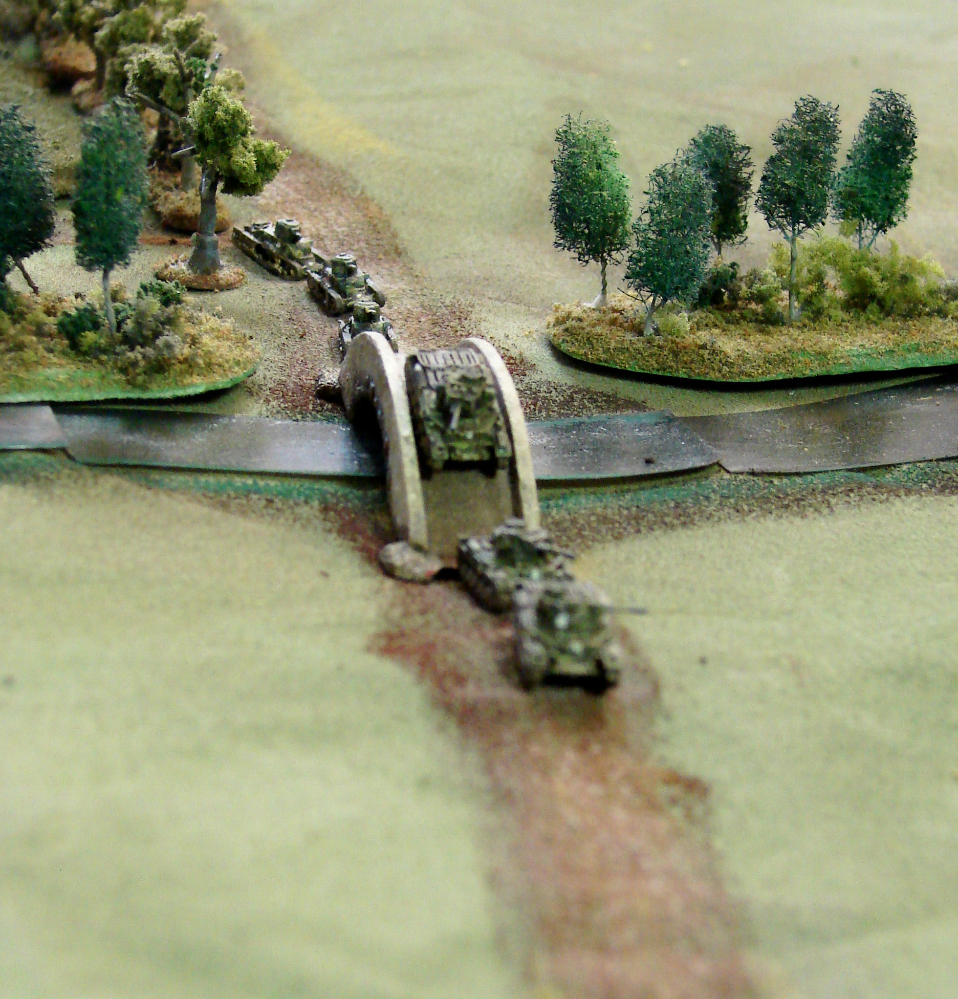 Looks like a good place for an... This is a nice chance to get a shot at the side armor and hopefully block the single lane bridge.