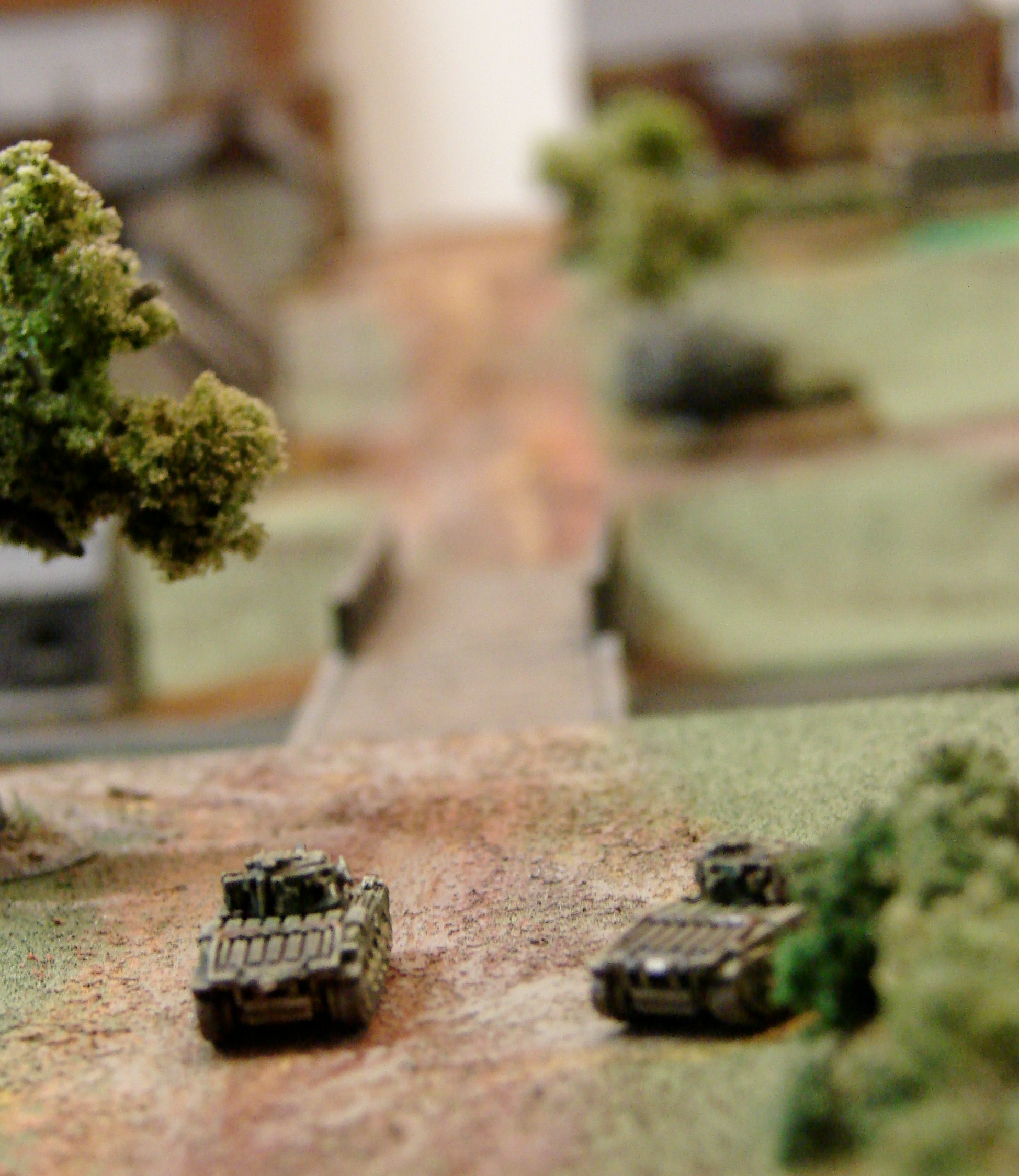 A bridge not so far The MkII on the right has taken a hit in the tracks from across the stream and the other MkII is just about to turn tail after receiving fire from across the stream also.