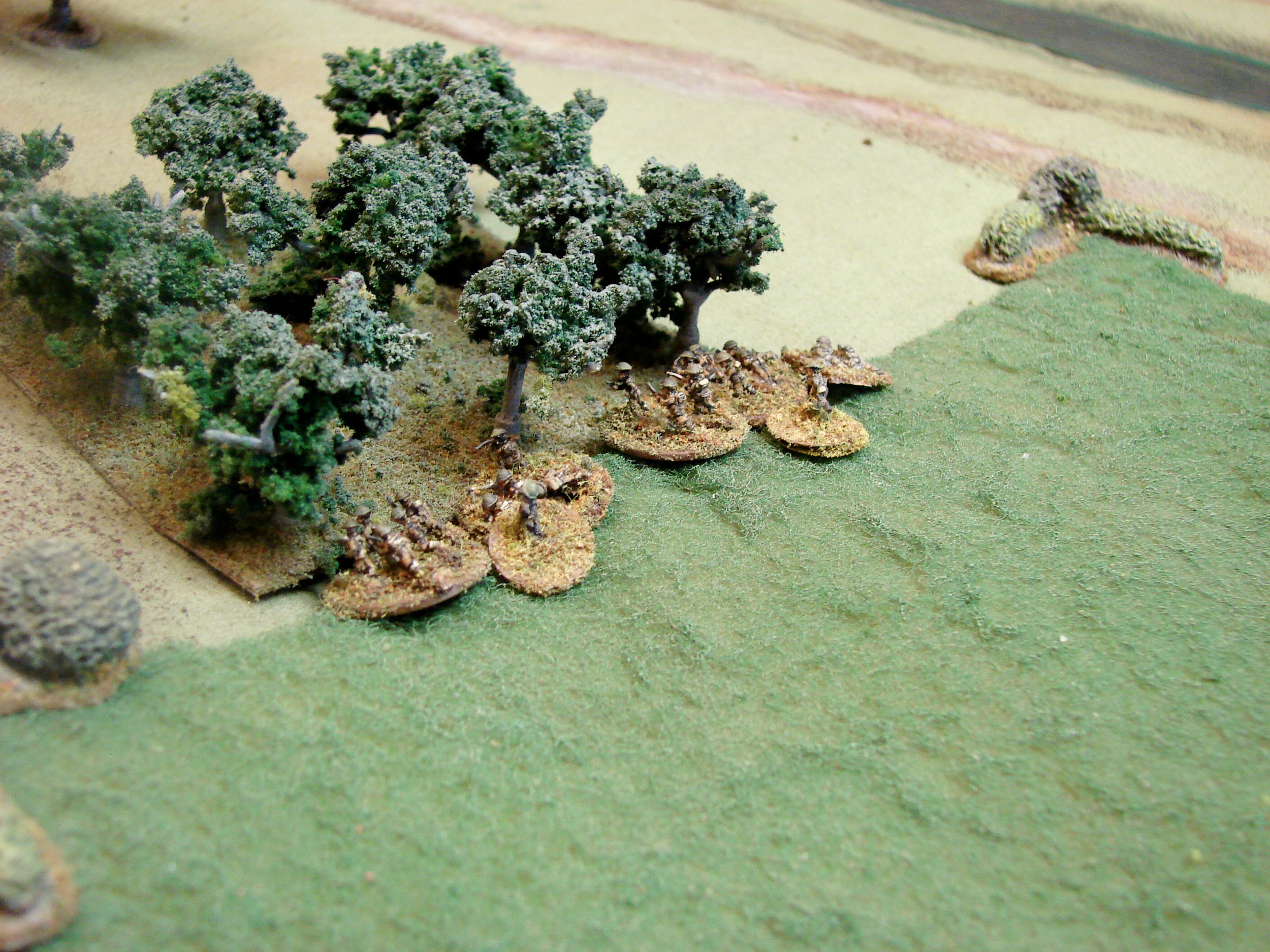 BEF infantry They managed to cover almost the whole board under a Blind. They crossed the stream on the opposite flank of the Matildas and are trying to get into the village before the SS can cover this flank.