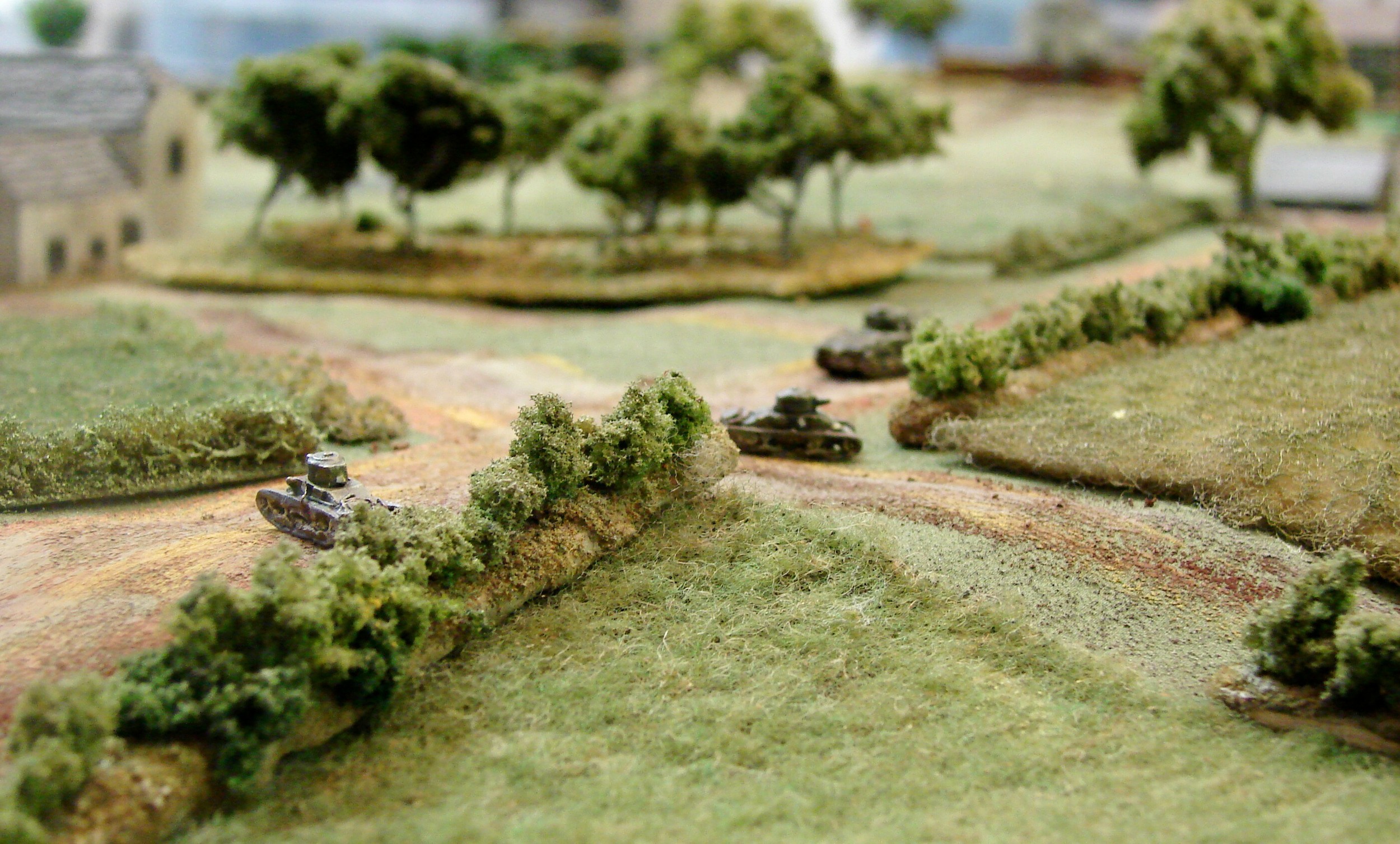 Finally finished with the forlorn hope The second group of MkIs discovers that there is nothing left to shoot at around the farm and orchard, and the remaining mobile tank heads towards the next objective. One Mk I took an track hit and the other one managed to throw a track in its manoeuvres.