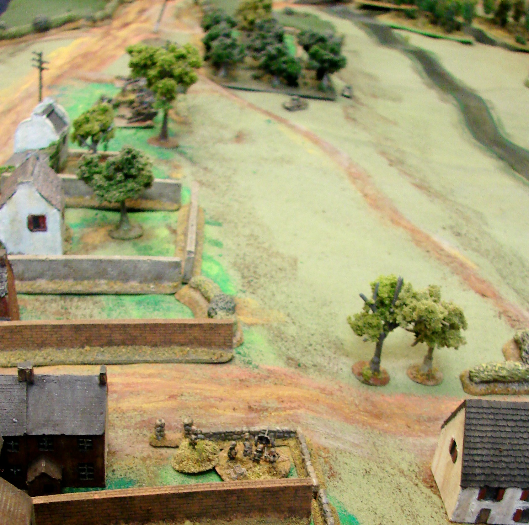 Pak tries to help The Pak35 in town fires into the flank of the charging Matildas, but the rounds just bounce off. Probably time to hook up and skedaddle.