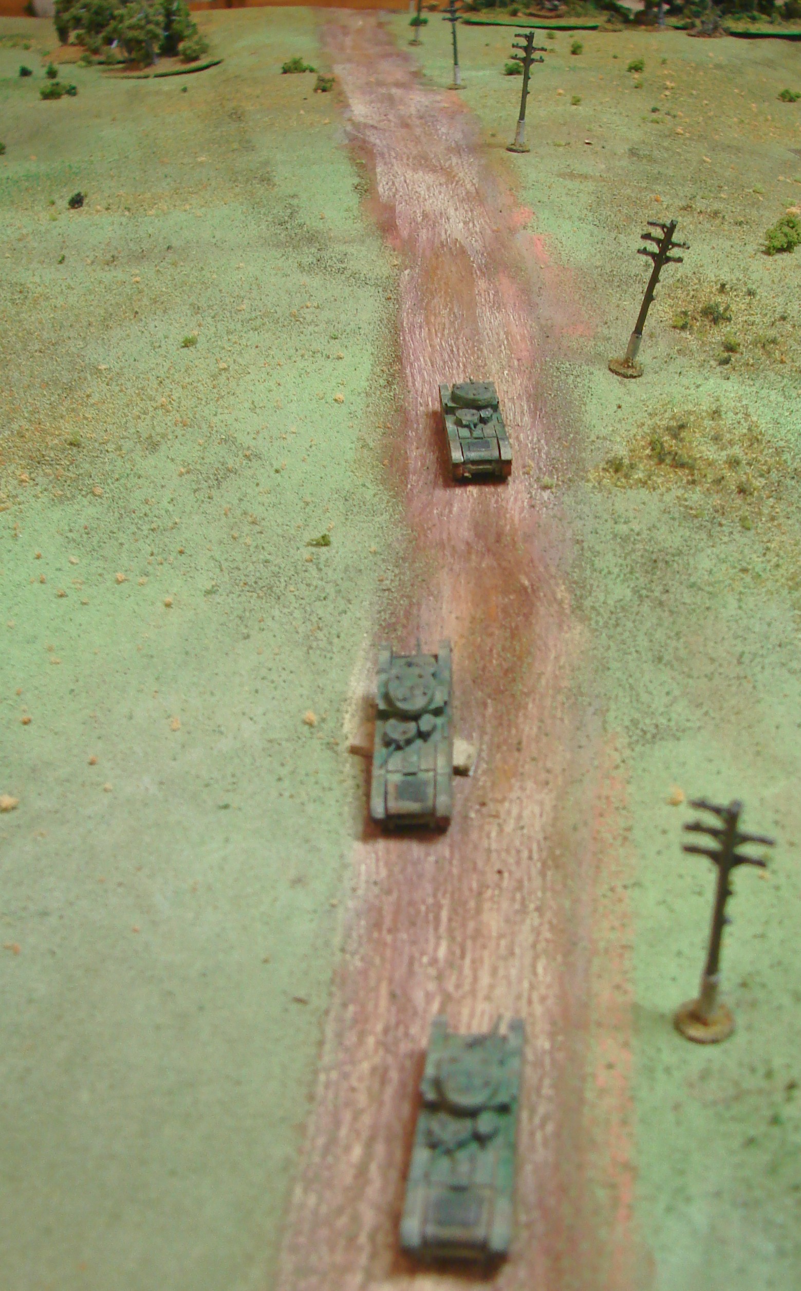 Up the Slope This was as far as the T35s would get. the first one takes several hits from a Pak35 and starts to burn The second tank is immobilsed and the crew only sticks around for a turn before they abandon ship. The third one gets a few shots off towards the trees where the Pak 35 btty is before it also is blazing. They were fun while they lasted.