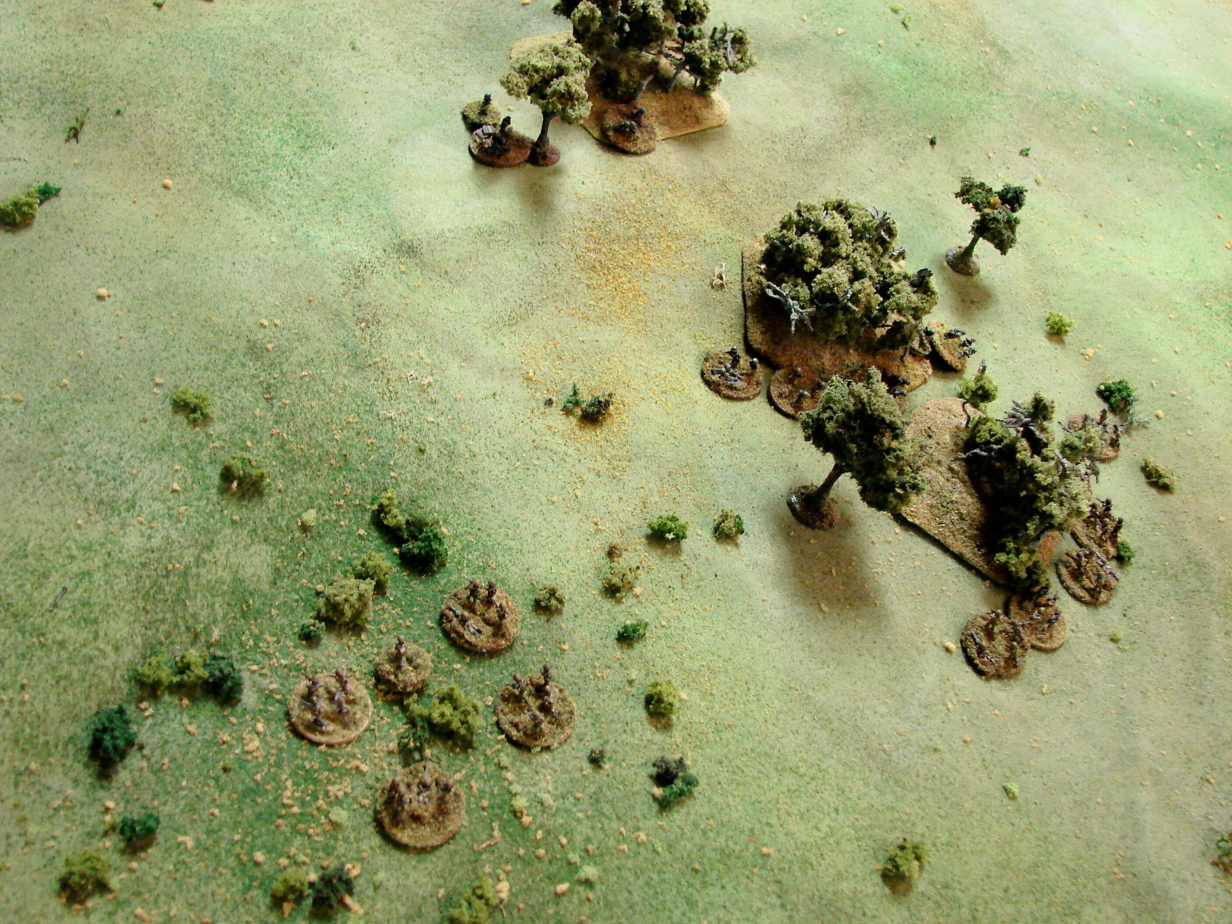 Trying to work behind the Grenadiers Most of a platoon following their CO heads up slope into some brush. A MMG team has just moved into place to cover that angle though.