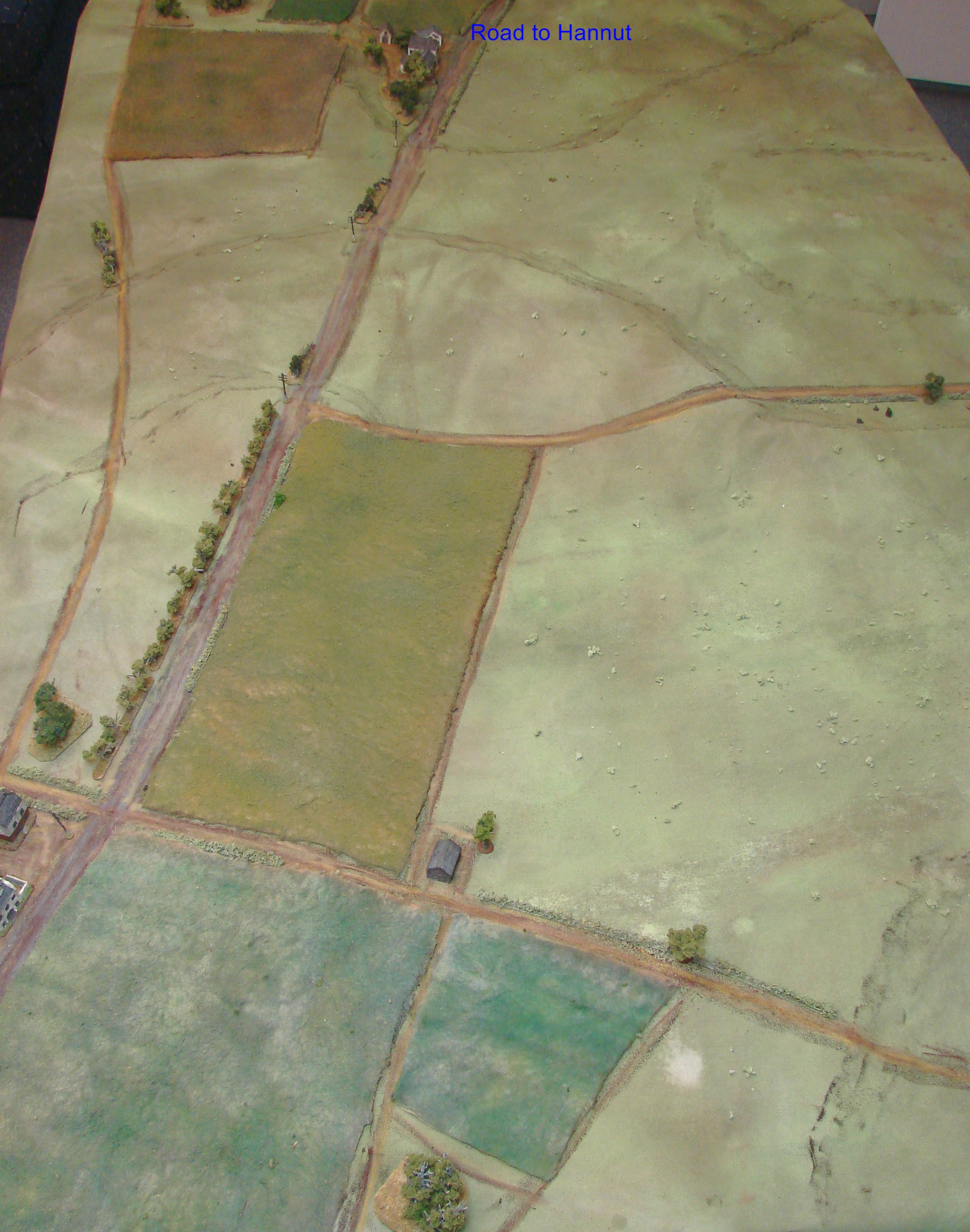 Overall view of the table: north at top The road from Hannut (offboard at top of table) was the eastern edge of the French lines. The 4th Pz was attacking from the right side of the table. Terrain was very open with a gentle rise from north to south.