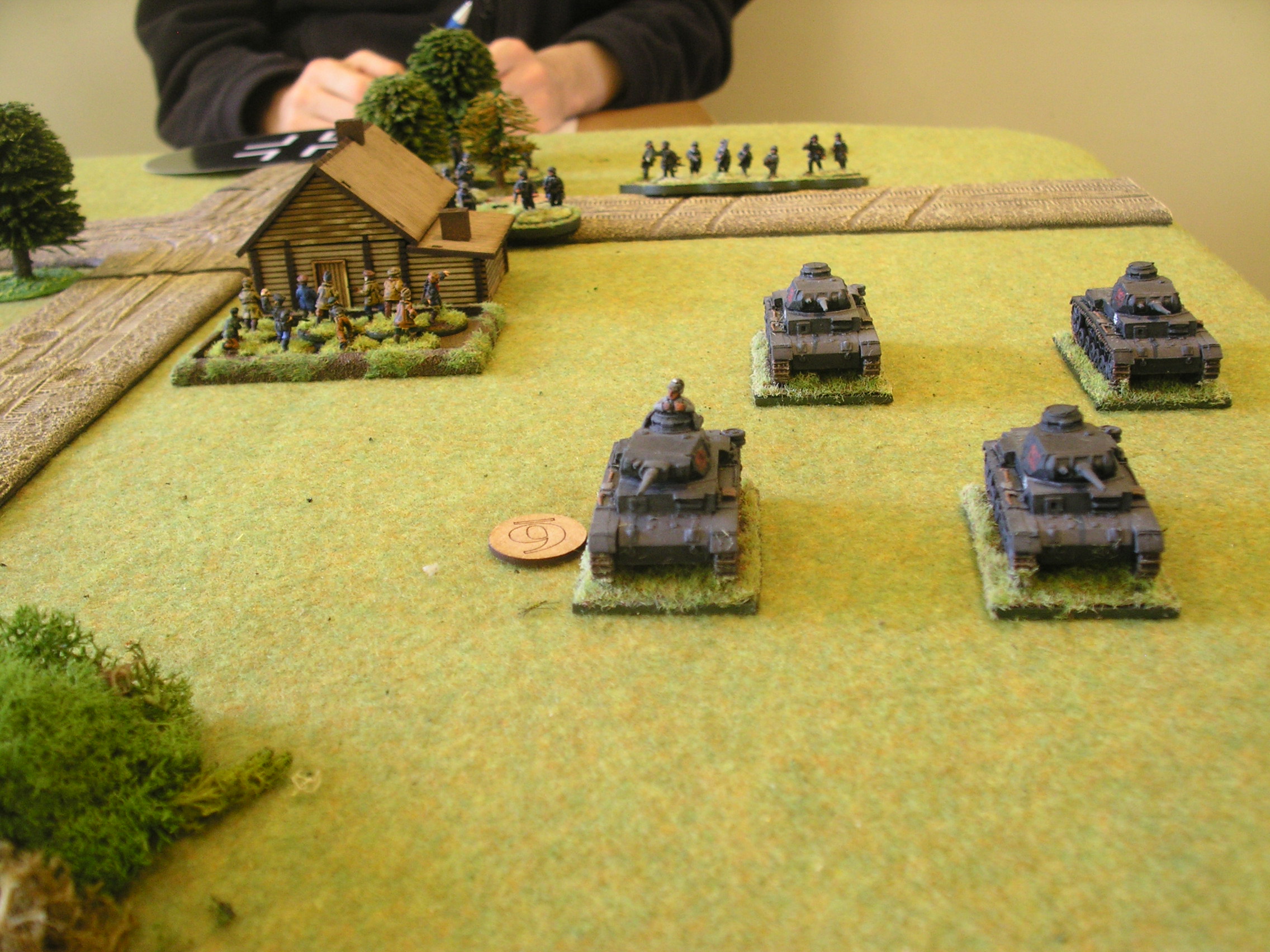 German Big Man Six leads his tanks forward