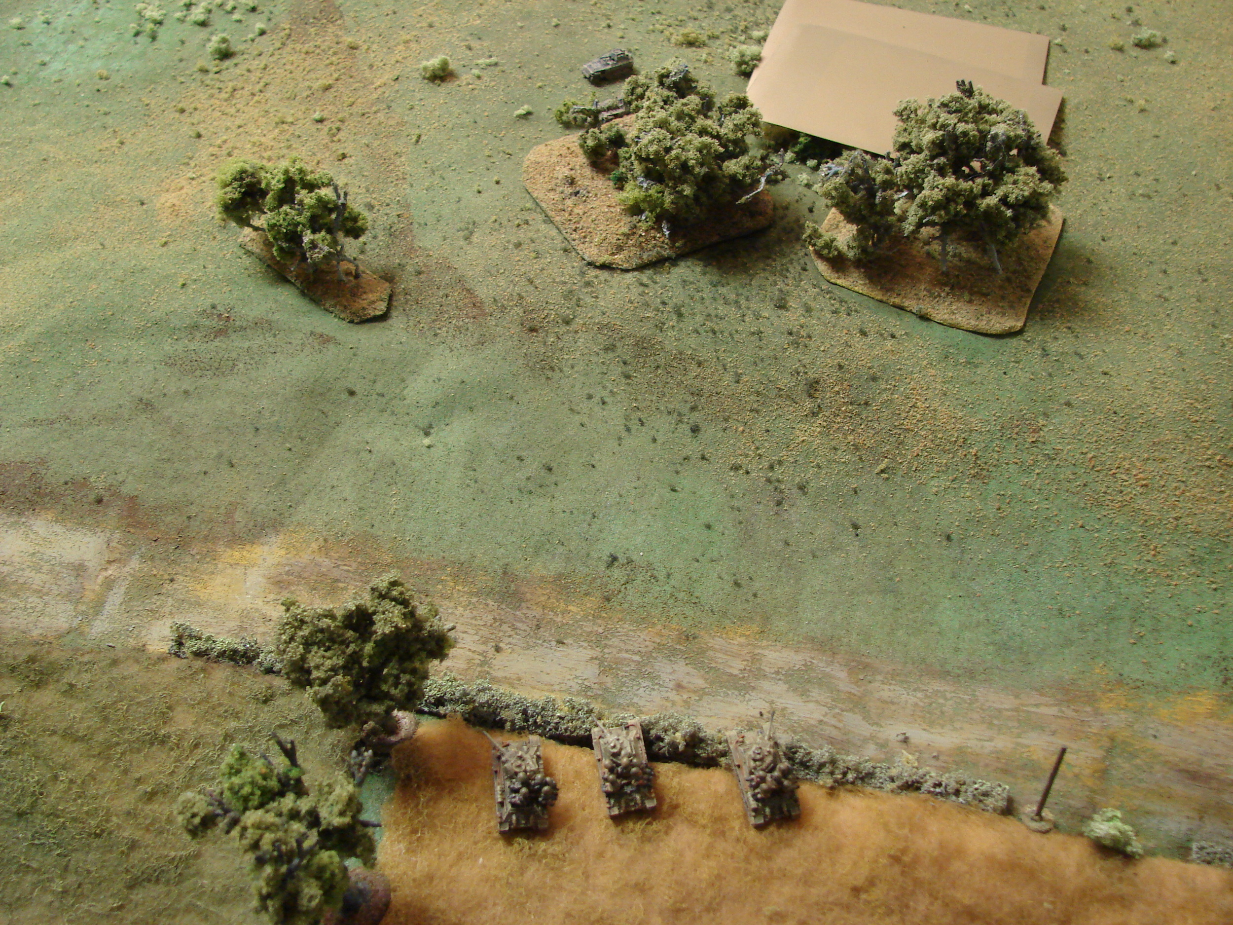 More T-34s They know something is firing from the backside of the copse. The Blind is the HQ group with an Sdkfz 250/3 and an Sdkfz 251/9.
