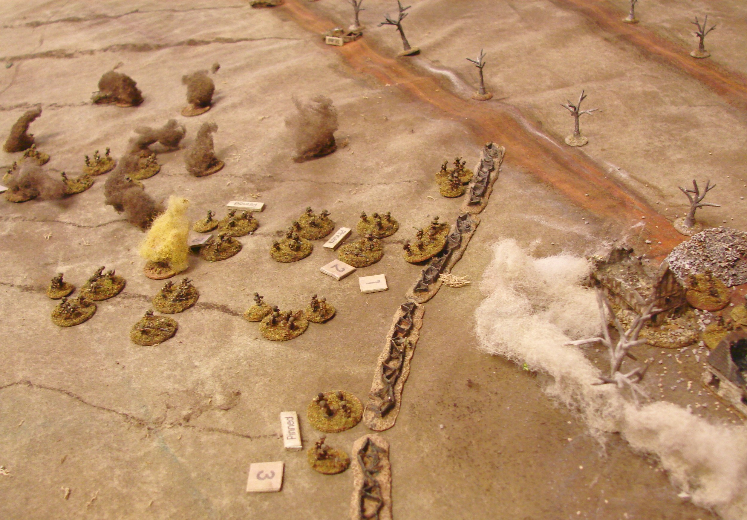 Smoke Finally The 2" mortars finally get some smoke down and some of the pioneers start to cut away the wire. Suppressive fire from the Vickers have had little effect so far.