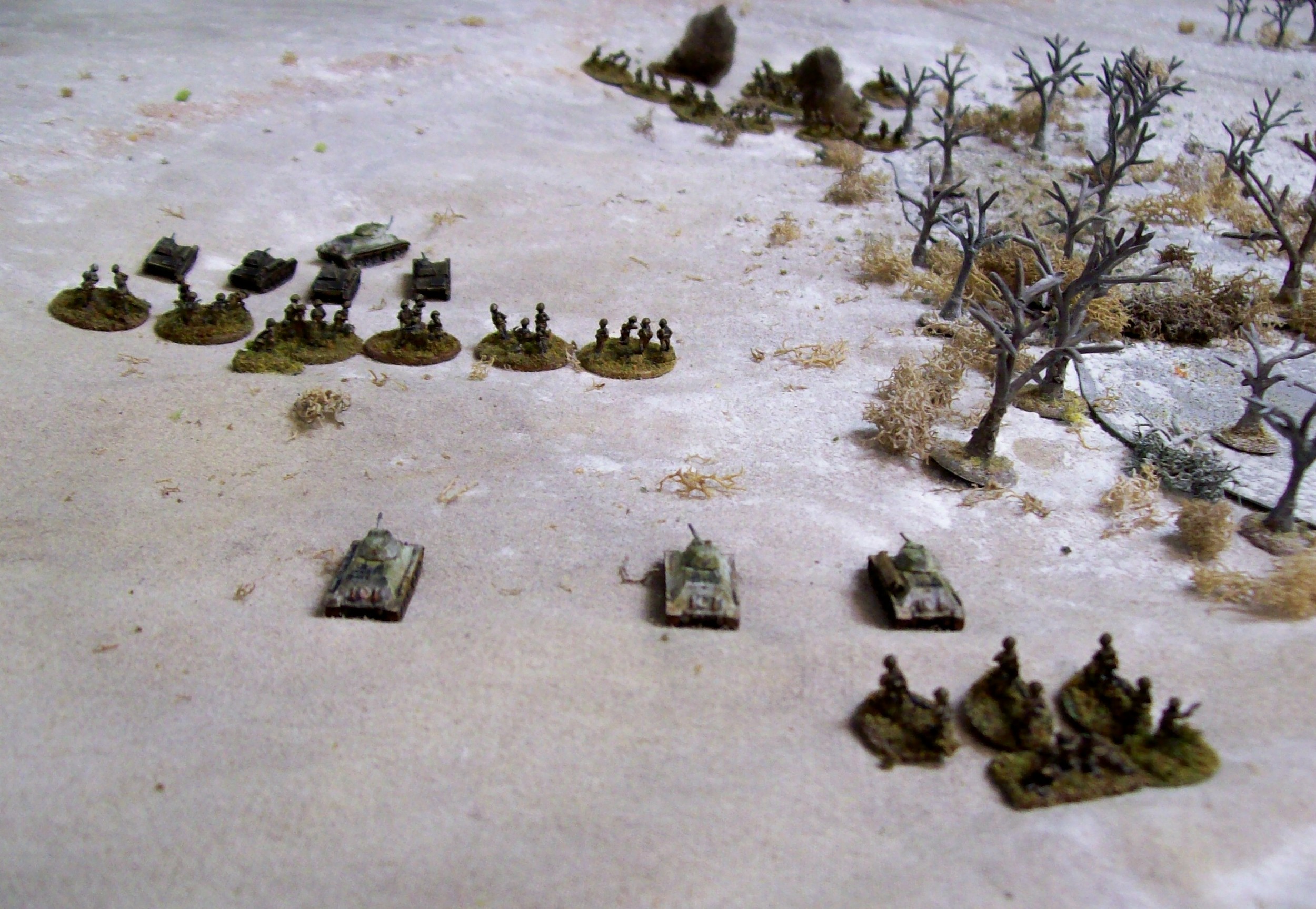More Red Infantry The 1st platoon moves up and begins to take some small arms hits. The tanks start to turn their attention to the Panzers. The Infantry HQ squad and some ATR-teams bring up the rear.