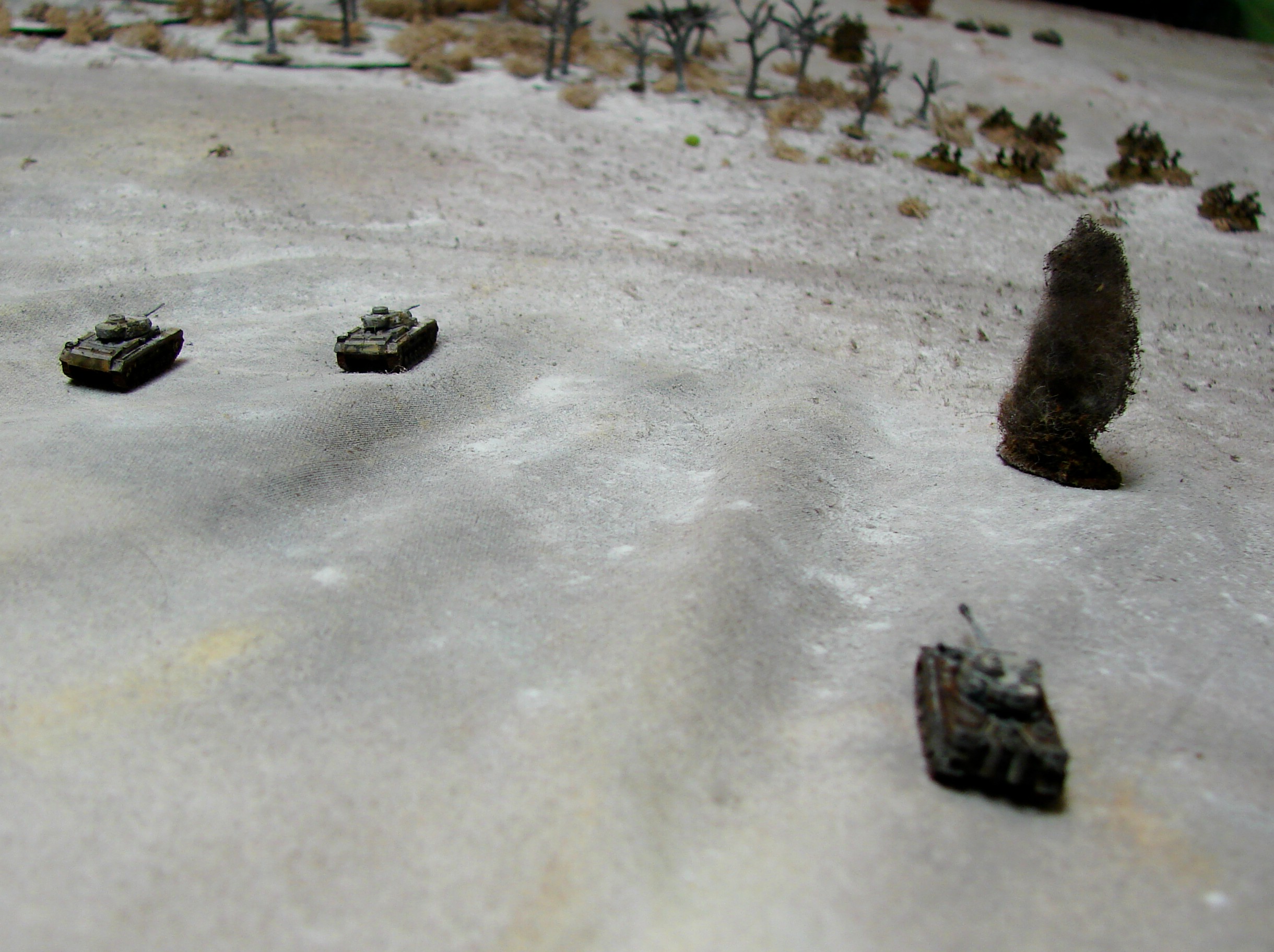 High Point of the Panzer Advance The PzIIIs move pass the Tiger and their smoking comrade to engage the Russkie tanks.