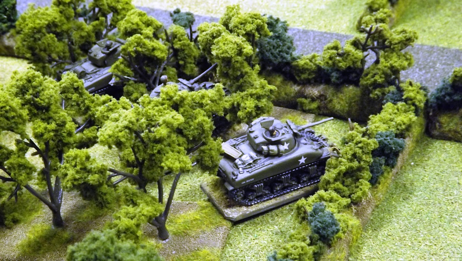 Much needed reinforcements from Utah beach as the Sherman tanks of the 70th Tank Battalion crash into town and join the fight.
