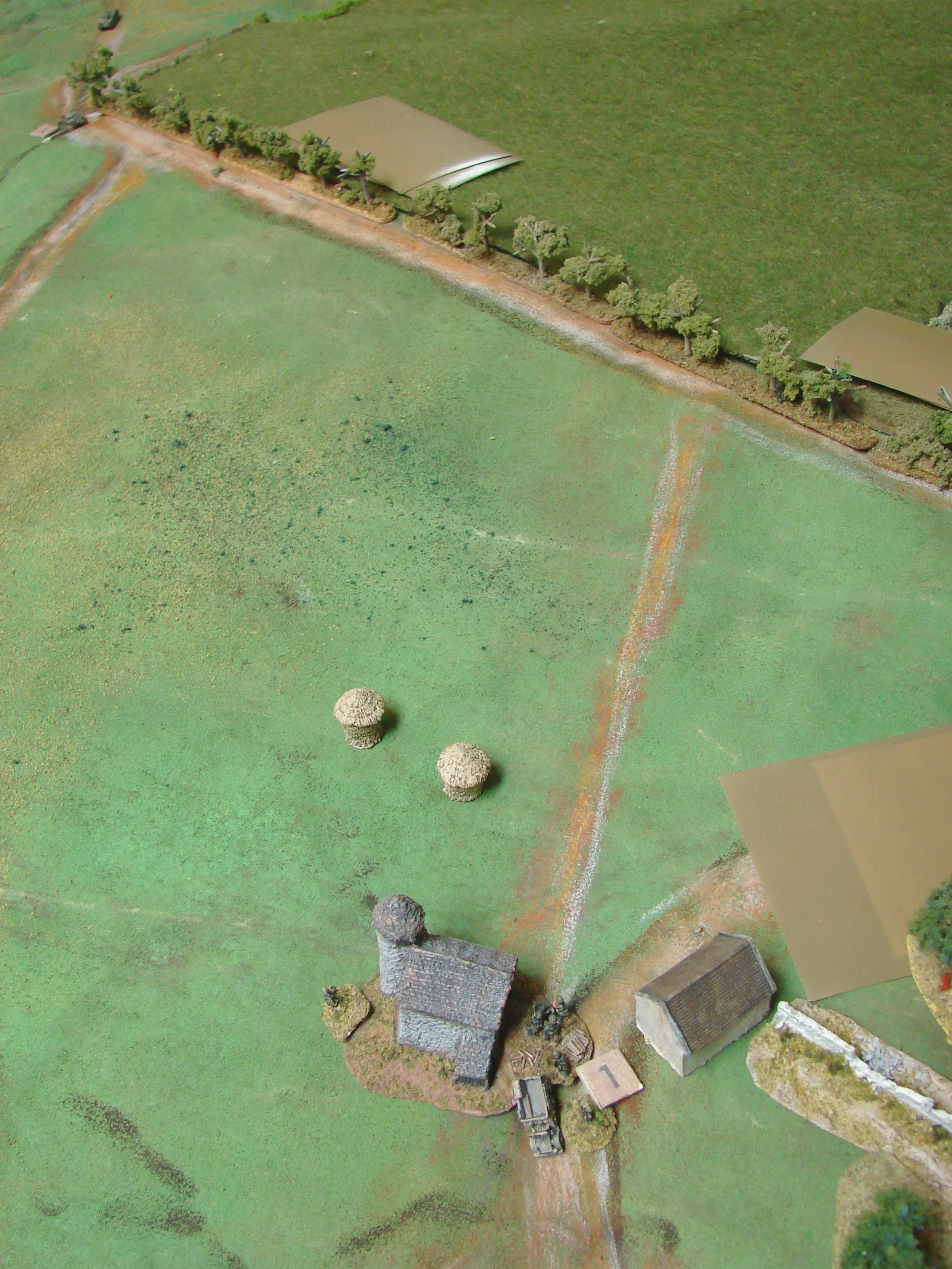 Back to the Farm The Kfz 69 and its Pak crew then dash to back to the cover of some farm buildings as the Char grinds slowly up the slope. More possible Germans in the tree line.