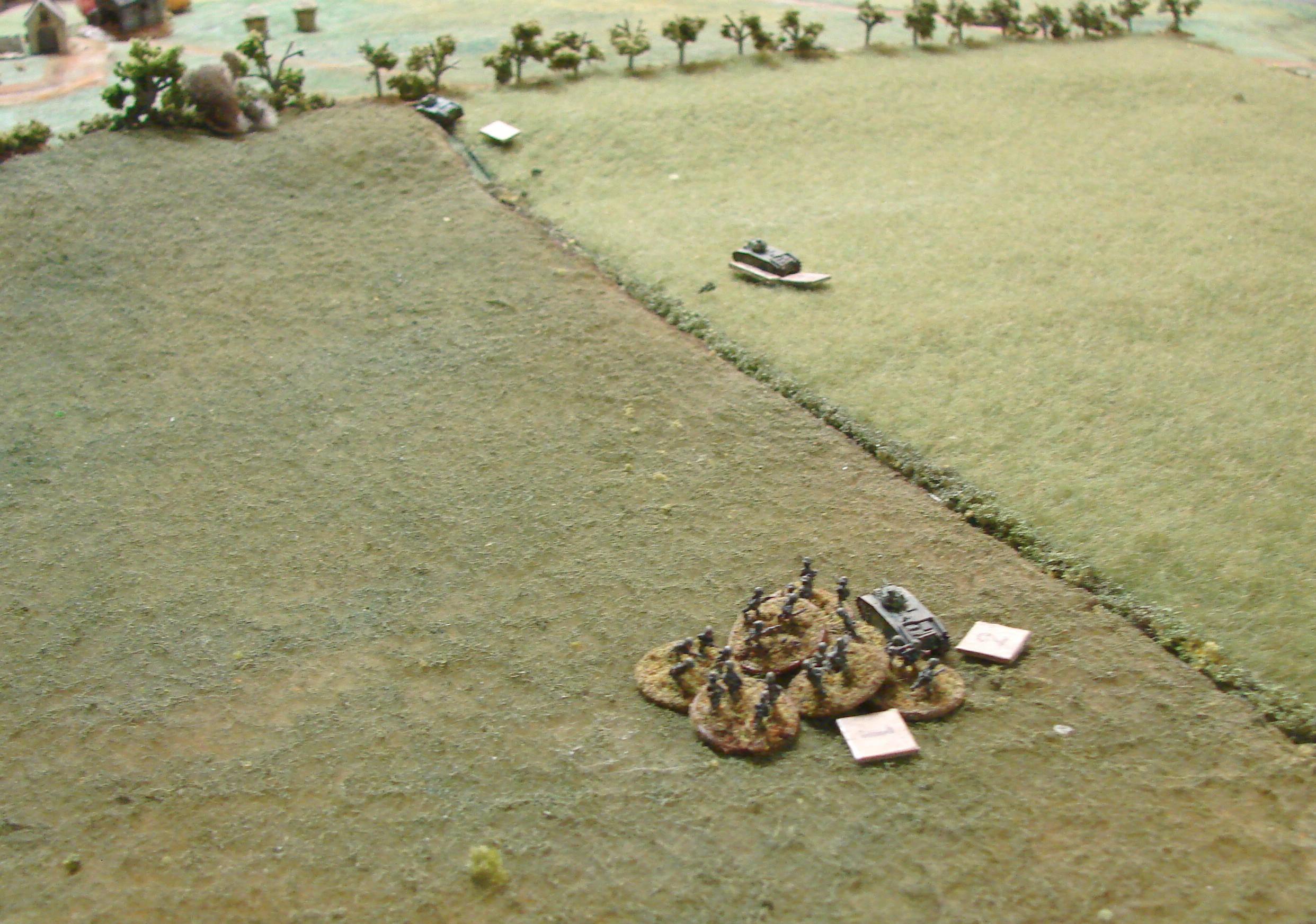 More infantry mobbing The tank managed to get off a futile burst of MG fire before it surrendered. The French are down to four runners now.