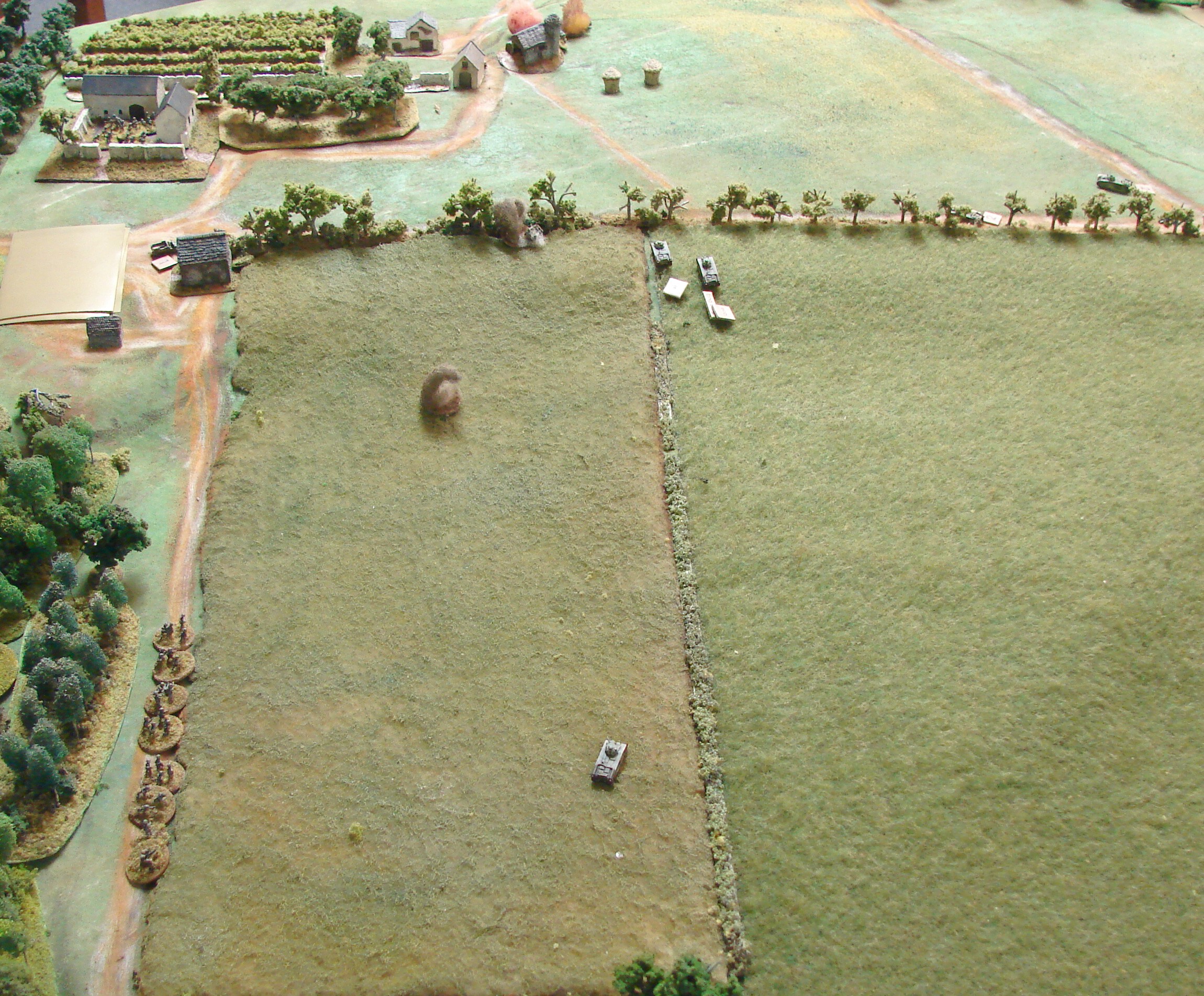 Back to the woods with the prisoners The Germans hustle the tank crew back to the woods as the other Chars head towards the farm.