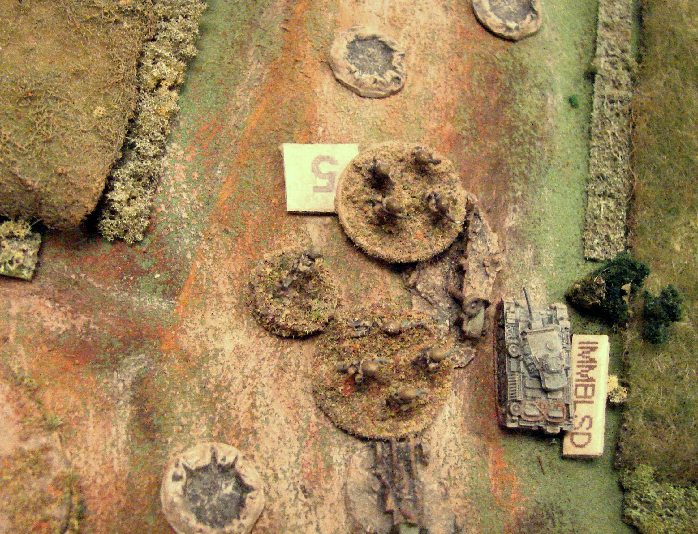Close assault immobilizes a Pz III As a Pz III works it way past a destroyed truck (Leva casting) the platoon Big Man leads a squad out from the station to attack the panzer. Random event card came up as Heroic Leader. They succeed in immobilising it, but the squad is cut up and the Big Man is killed by 20mm fire from the tanks behind.