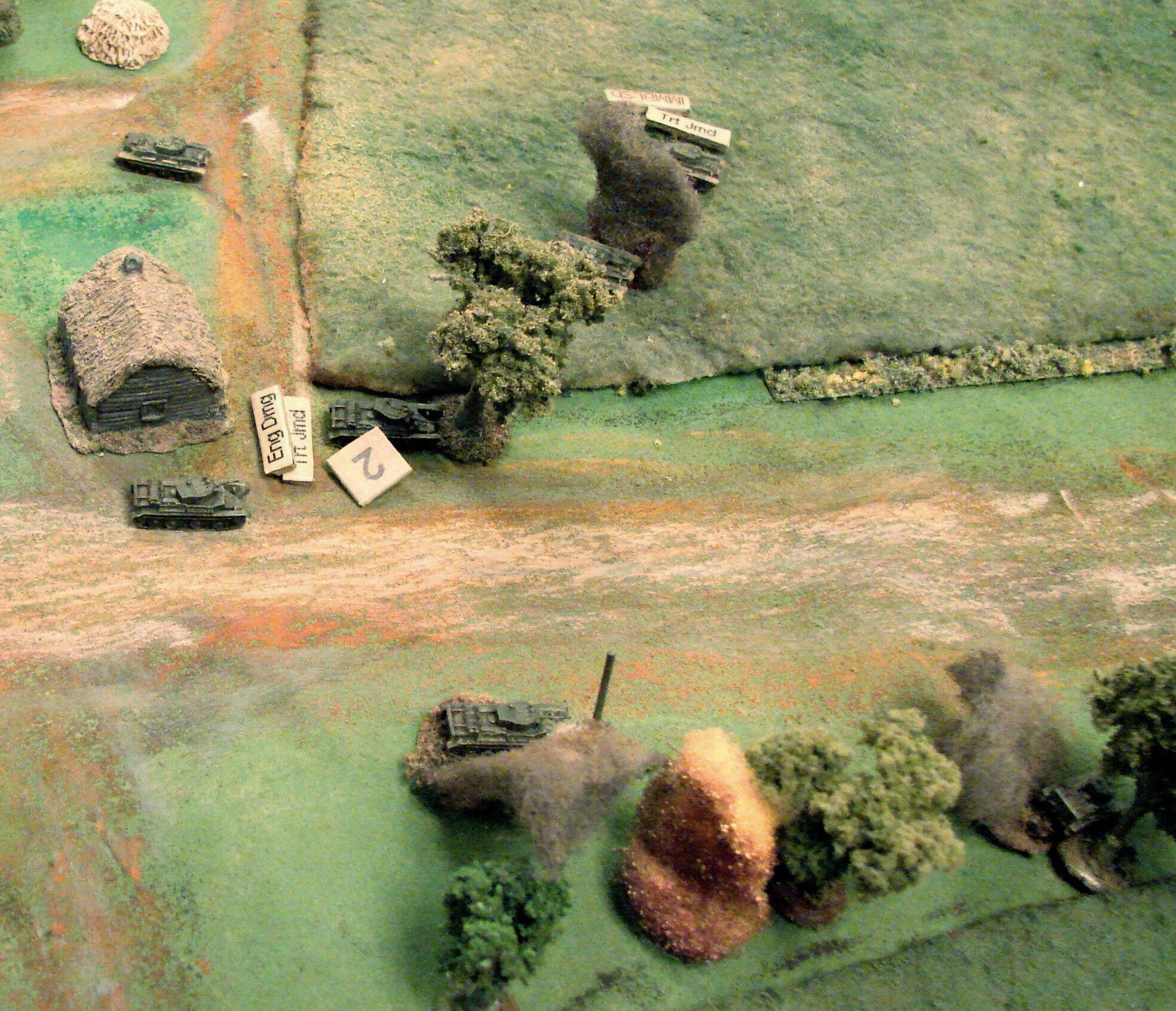 Last of the Red Armor Burning and abandoned BT7s mean that the game is over. The Soviets lost all their armour (8 BT7s and 9 T26s). The 1st Battalion of the 15th Panzer Regiment lost a Pz II and a Pz III but had two more Pz IIIs immobilised along with a Pz II and Pz IV, so they had ten out of sixteen tanks running at the end. Soviet infantry losses were about 30%, and one platoon CO KIA. This is a German victory but not as decisive as it might have been.