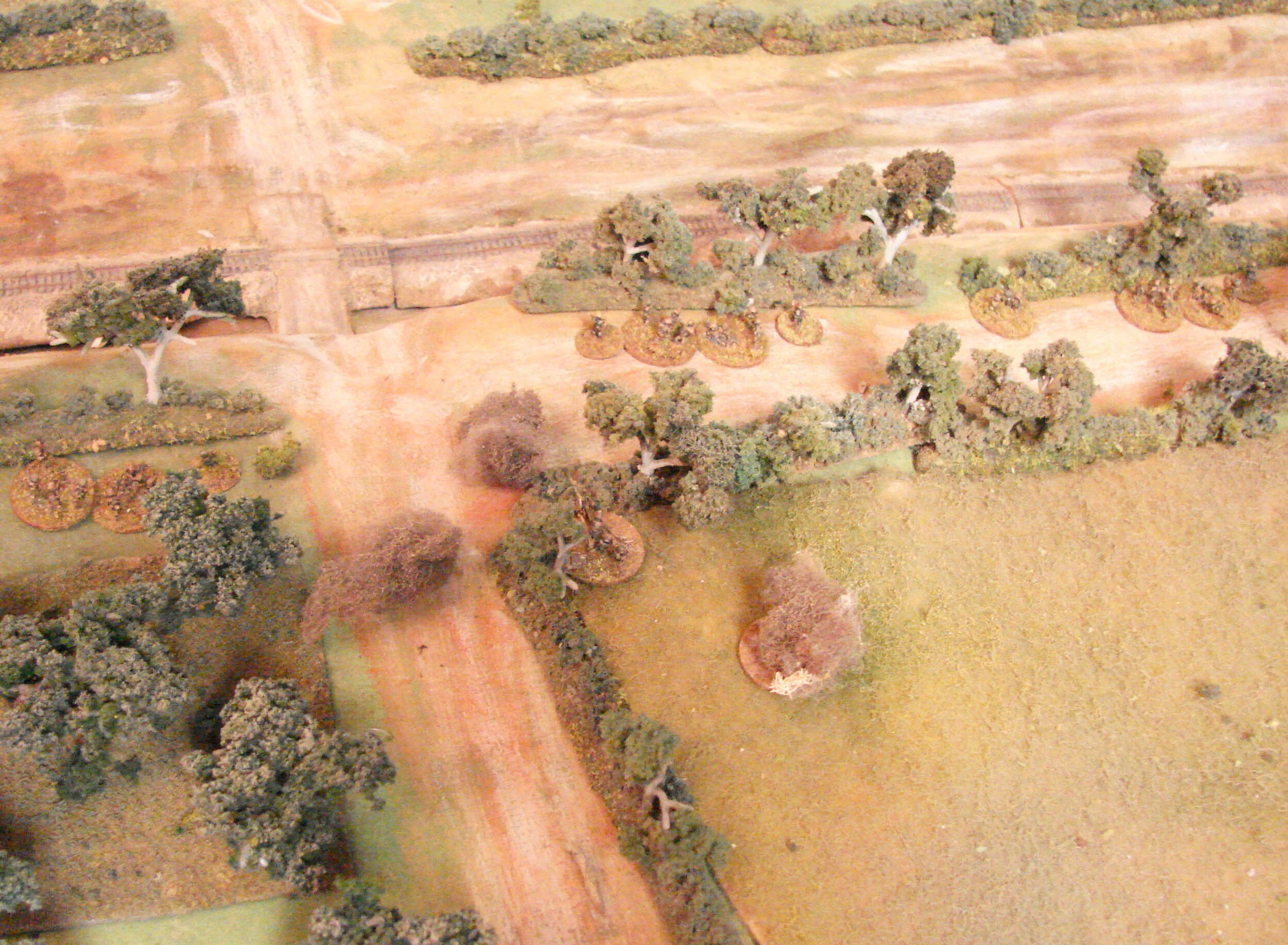ATG under fire The tankers respond by shelling the area with their 75/17pdr. This does cause a few casualties. The grenadiers are shown deployed behind the hedgerow overlooking the RR cut.