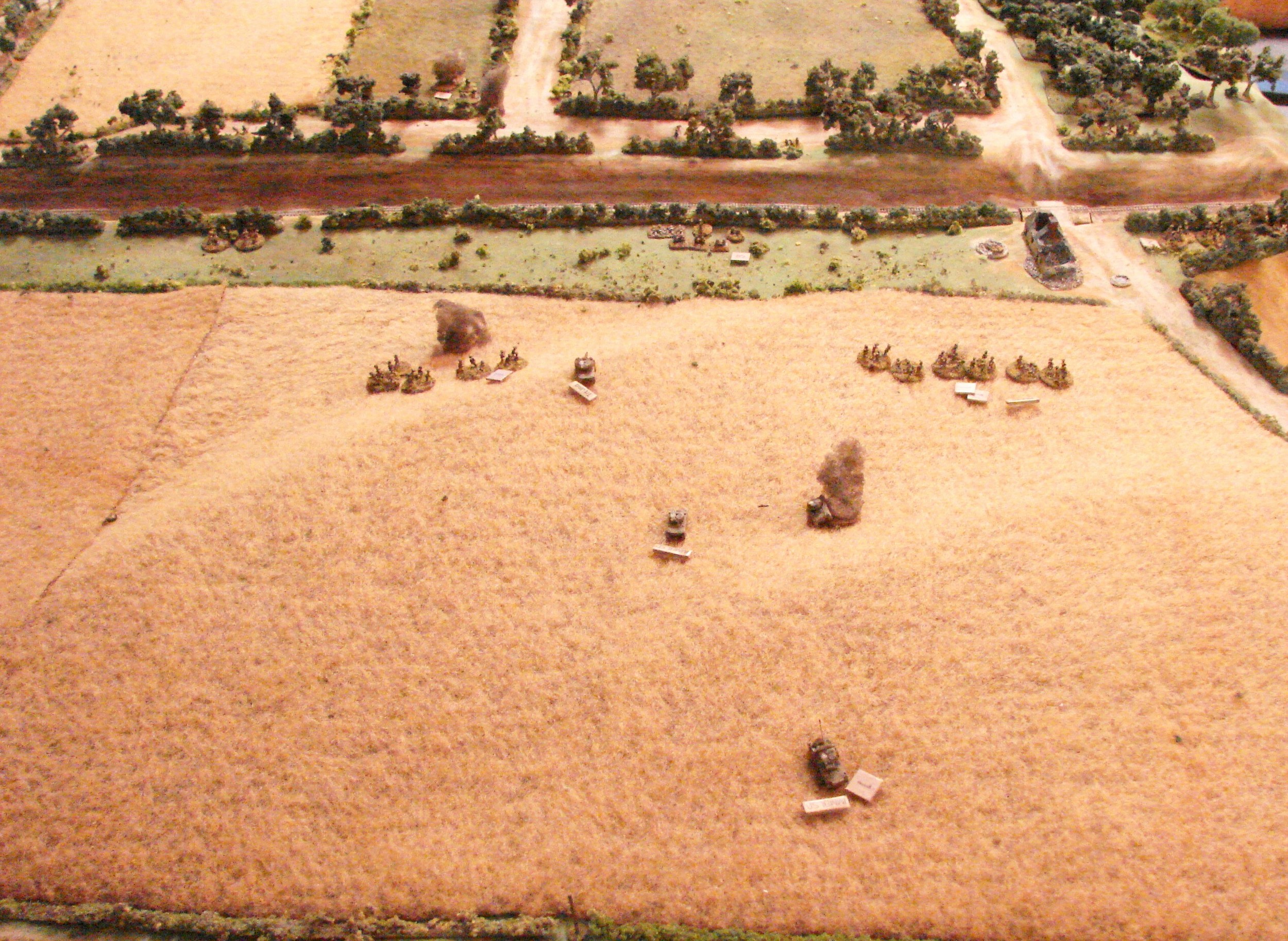 Stalling out The British infantry is getting stalled out. A spotting round just arrived. The British FO can't seem to get its batteries up. The Firefly started down the slope and took a couple of hits from the Pak that is still in operation despite several casualties.