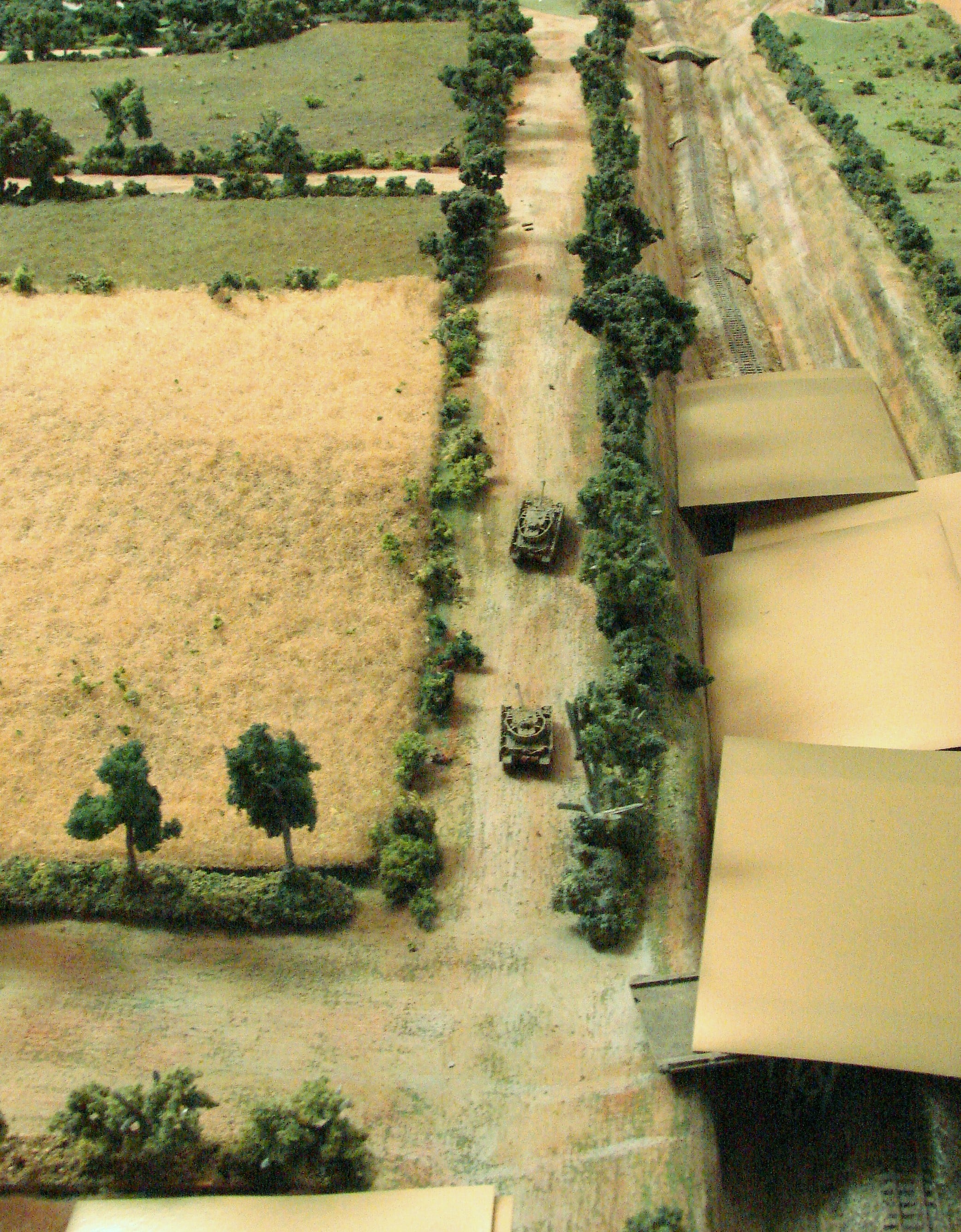Lead elements of the attack The Pz IVs lead a road column and grenadiers move along the RR cut. The beige cards are the blinds that they are moving on.