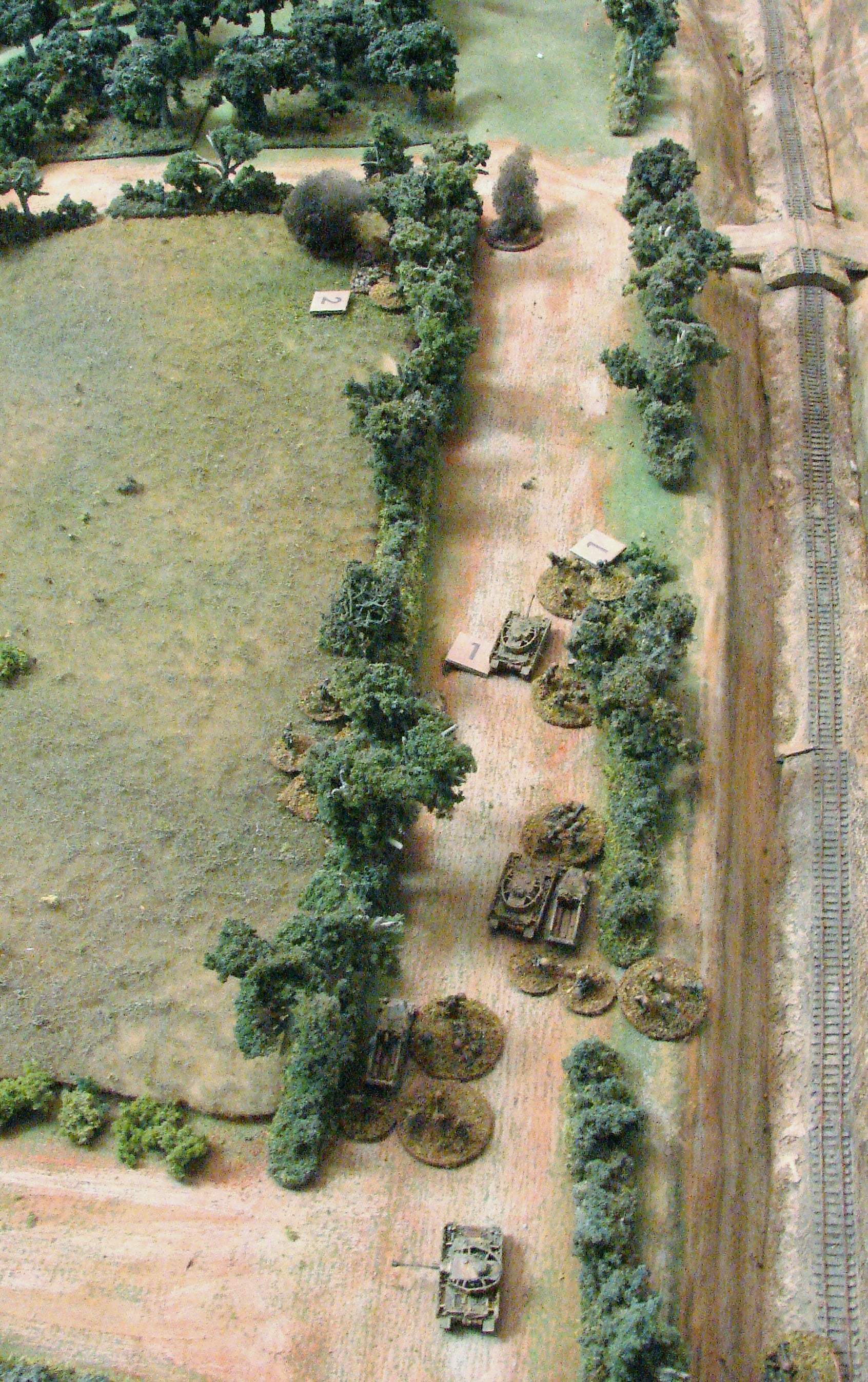 HE on the Brits The Panzers resort to their 75mm guns in an attempt to keep the Brits pinned while the Grenadiers move up.