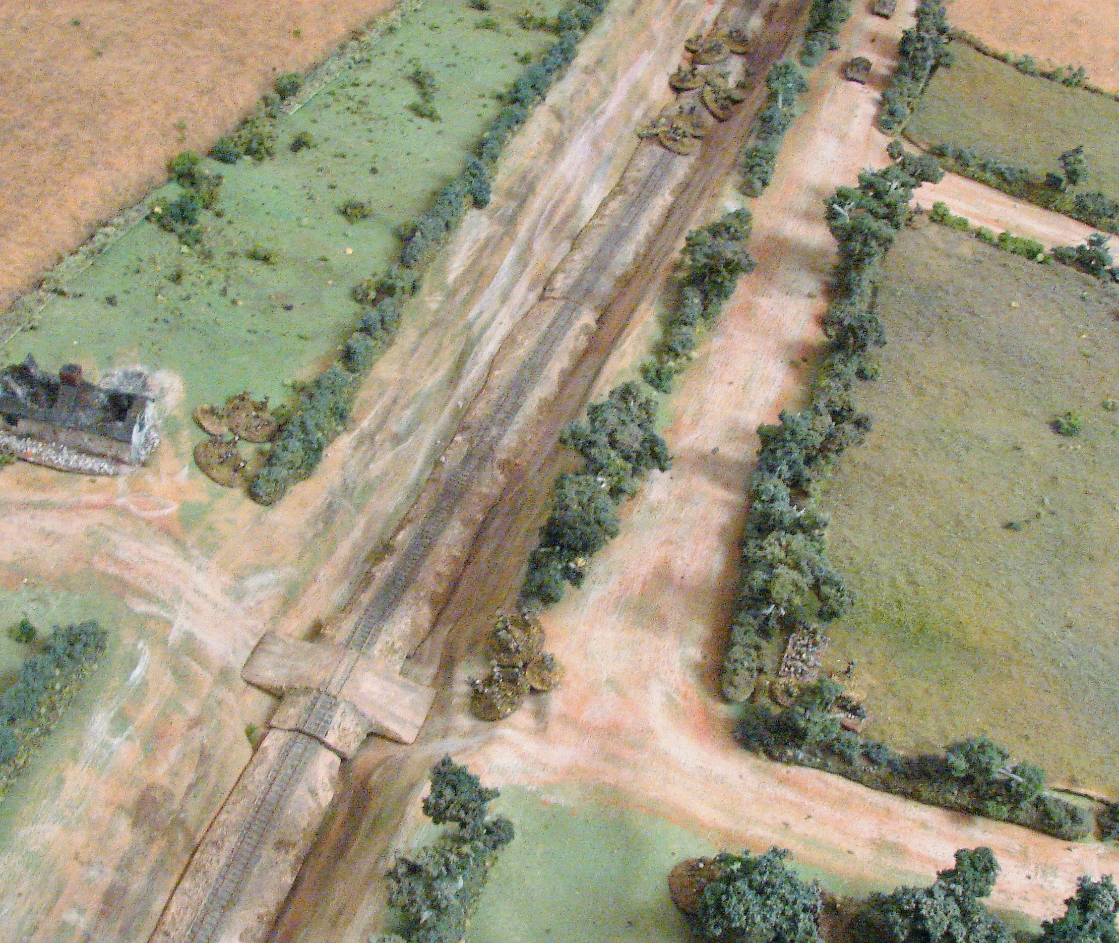 Defenders sighted The remaining squad and the platoon leader are in the field behind the bocage at the corner.