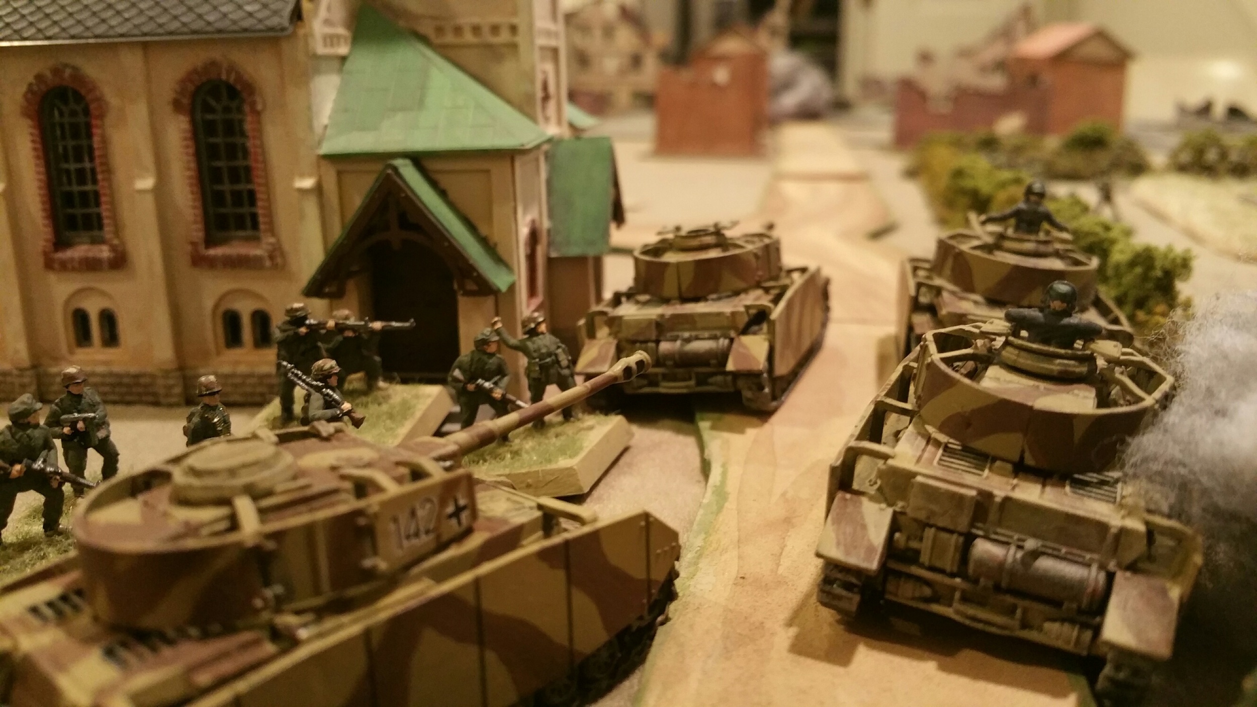  Burning German Panzer IVs stack up after bazooka teams and Shermans &nbsp;plug the gap.  