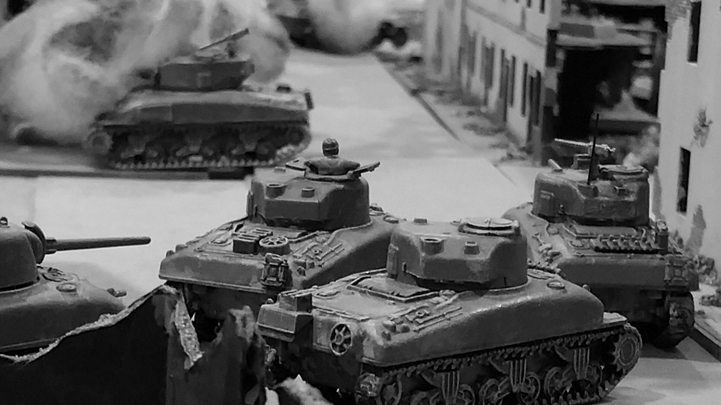   The surviving Shermans cower behind the last building in town, awaiting the last Tiger's approach.  