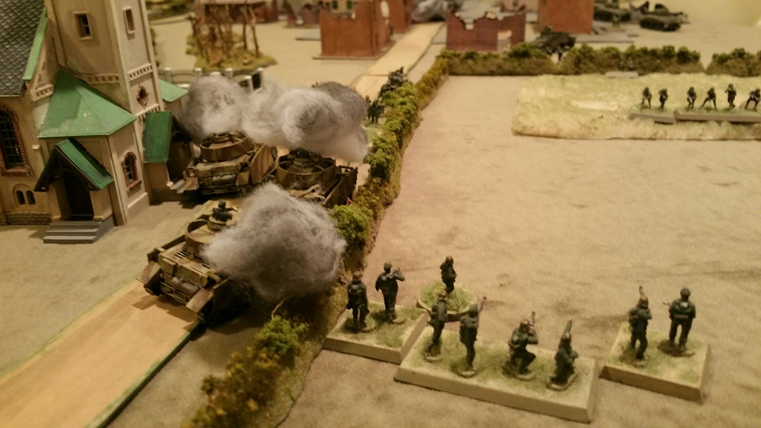   &nbsp;Left flank road around the church is blocked with burning wreckage but German infantry turns the position, defeats the American platoon, and pushes into town.  