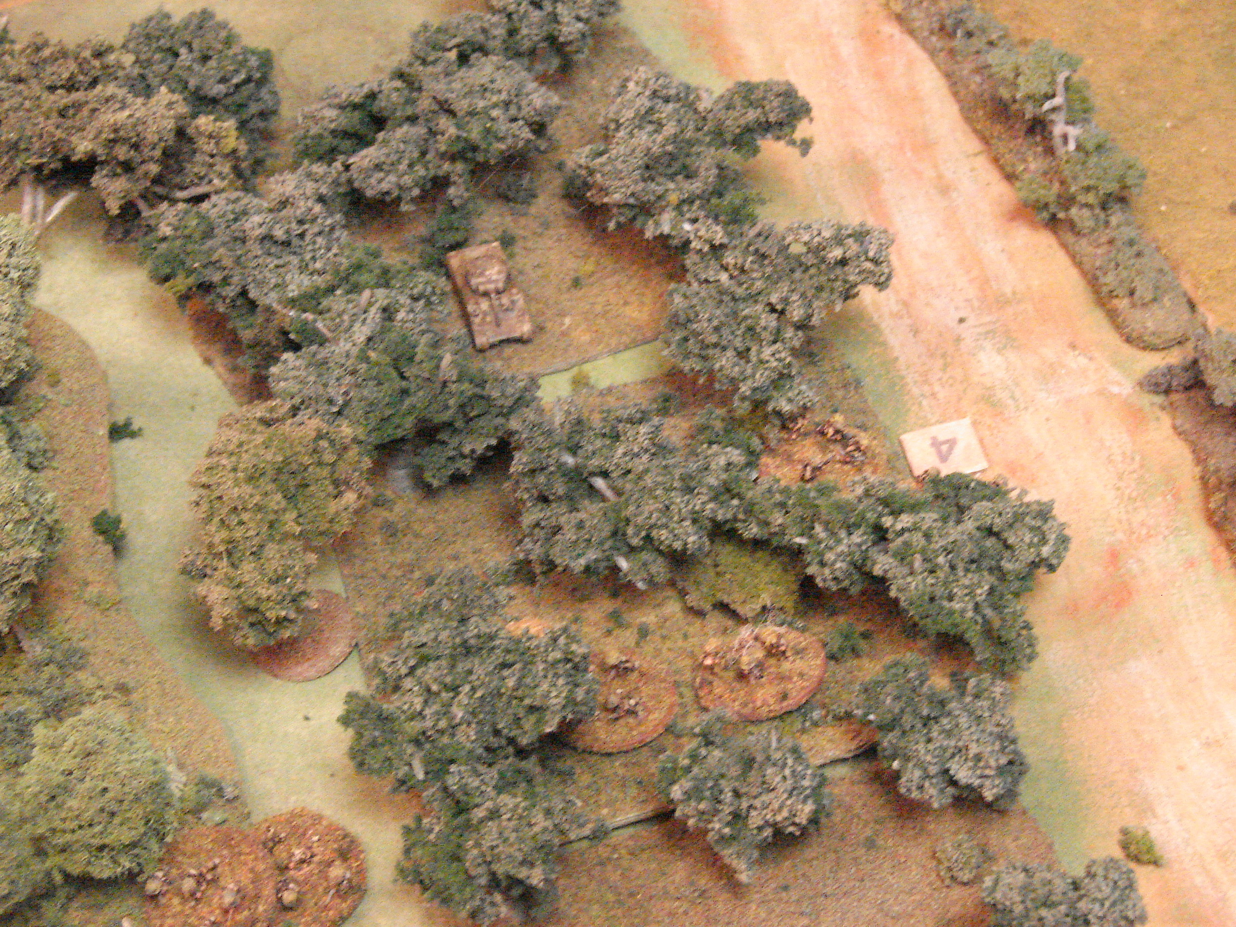 In the orchard One of the Gordon platoons moves through the orchard with a couple of Shermans in support. They have taken some fire from further down the road.