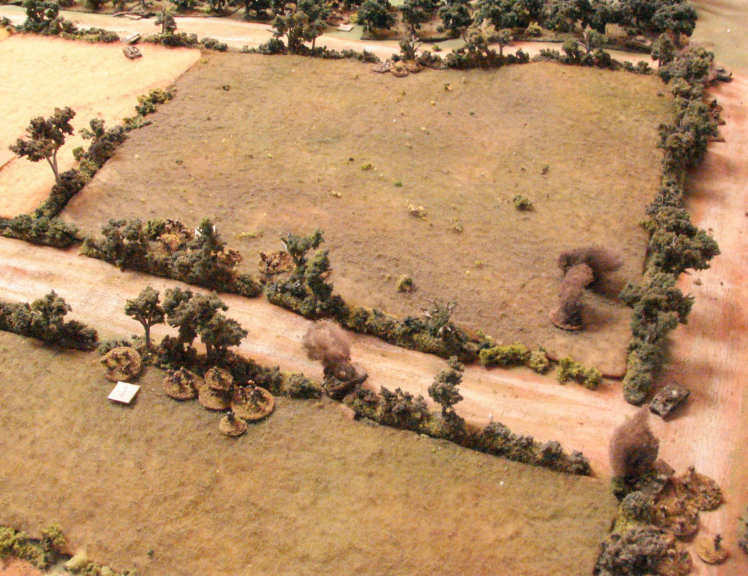 Another Firefly brews The grenadiers fired a couple of panzerfaust at it but it was a hit from the Tiger's 88 that blew it up. The Brits and grenadiers are trading fire across the road. StuG switches its HE fire as it retreats.