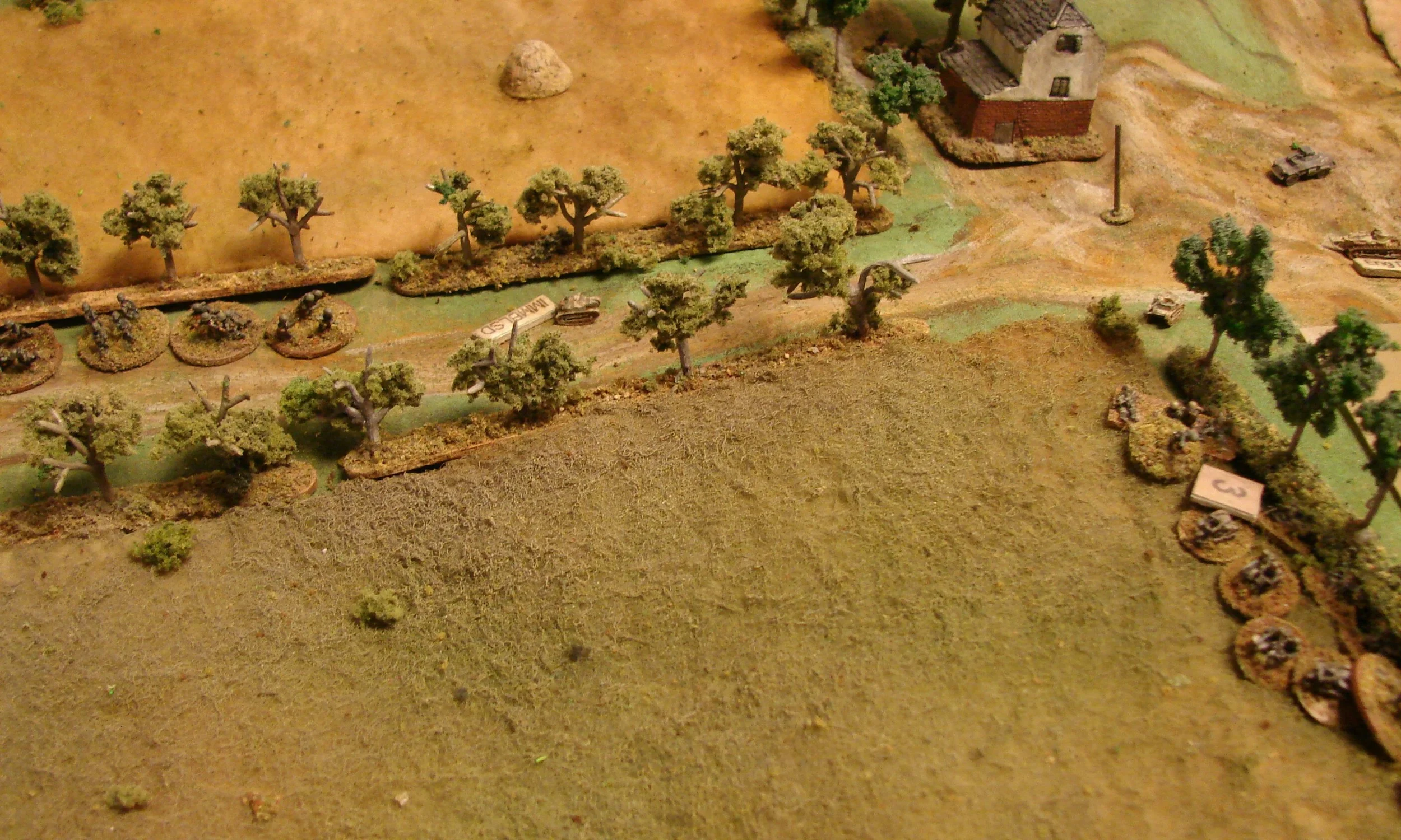 Back to the bikers Two of the m/c squads dismounts along the lane. One squad is forced to dismount back at the first tree line due to hits from the tankette. The platoon leader goes back to try to rally them.