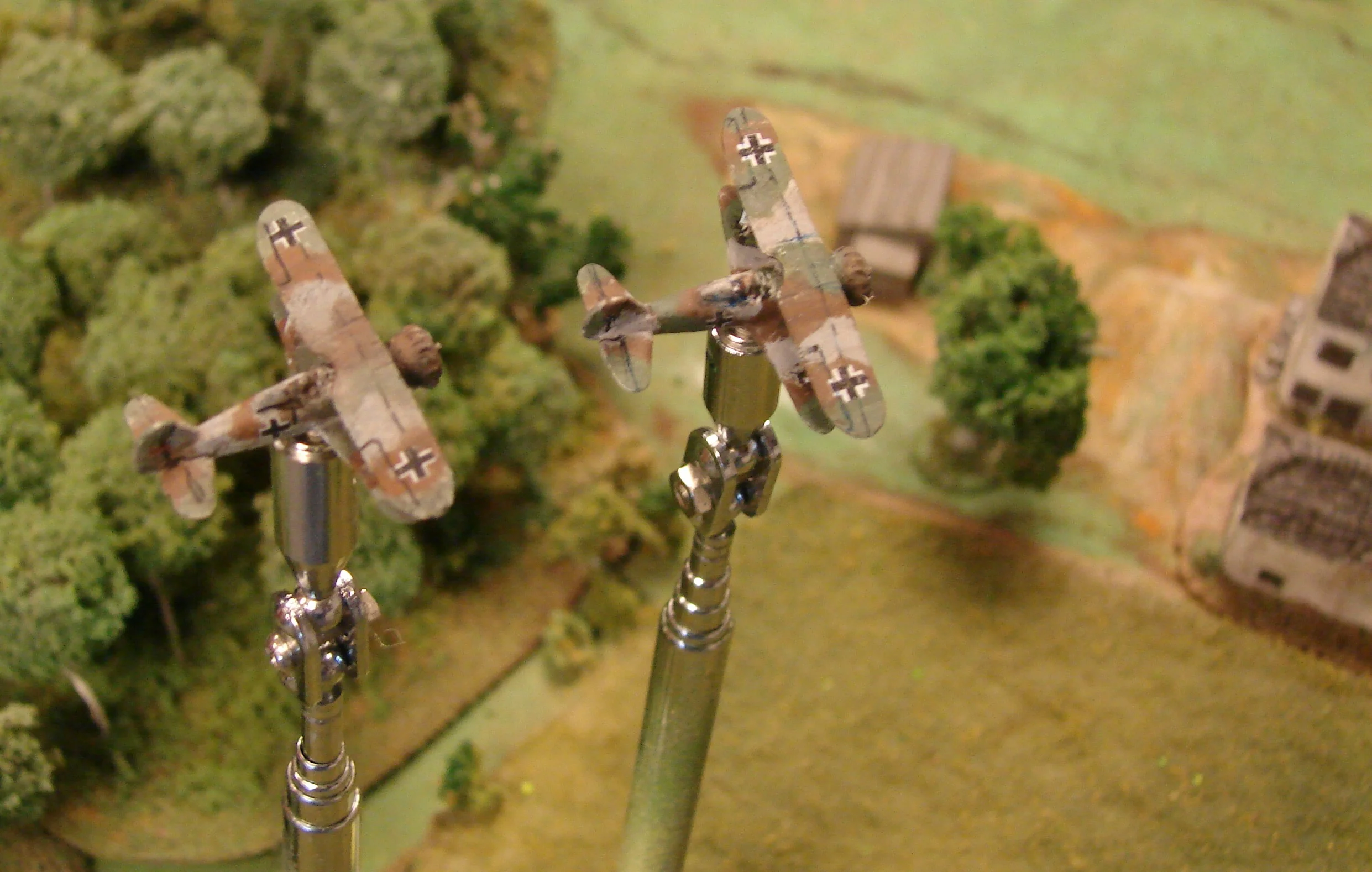 Looking for a train to catch A couple of HS 123s (Navwar models) arrive over the table. They spot the steam & artillery fire coming from the train.