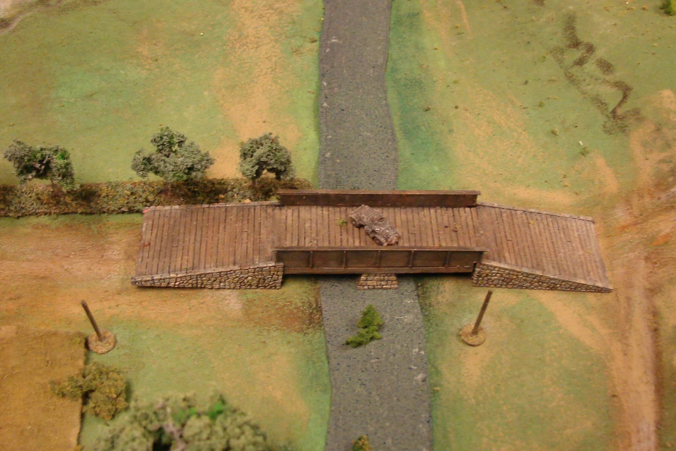 None Shall Pass A Sdkfz 221 is left guarding the bridge.