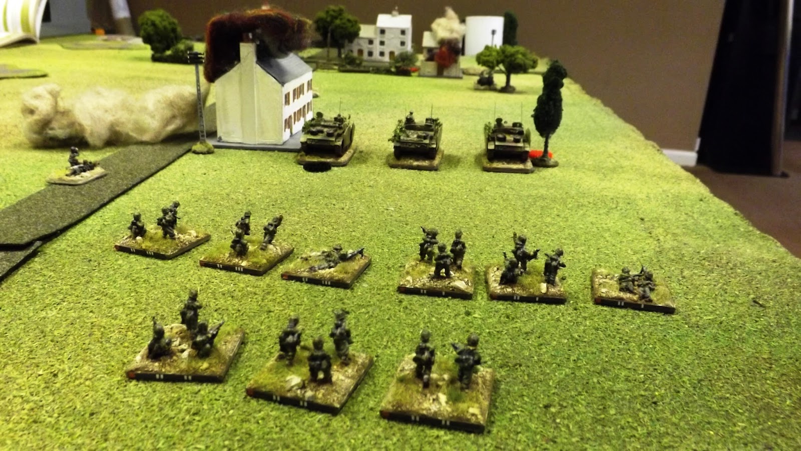 As the StuG's open fire on the first line of buildings they themselves come under punishing AT fire from the front right