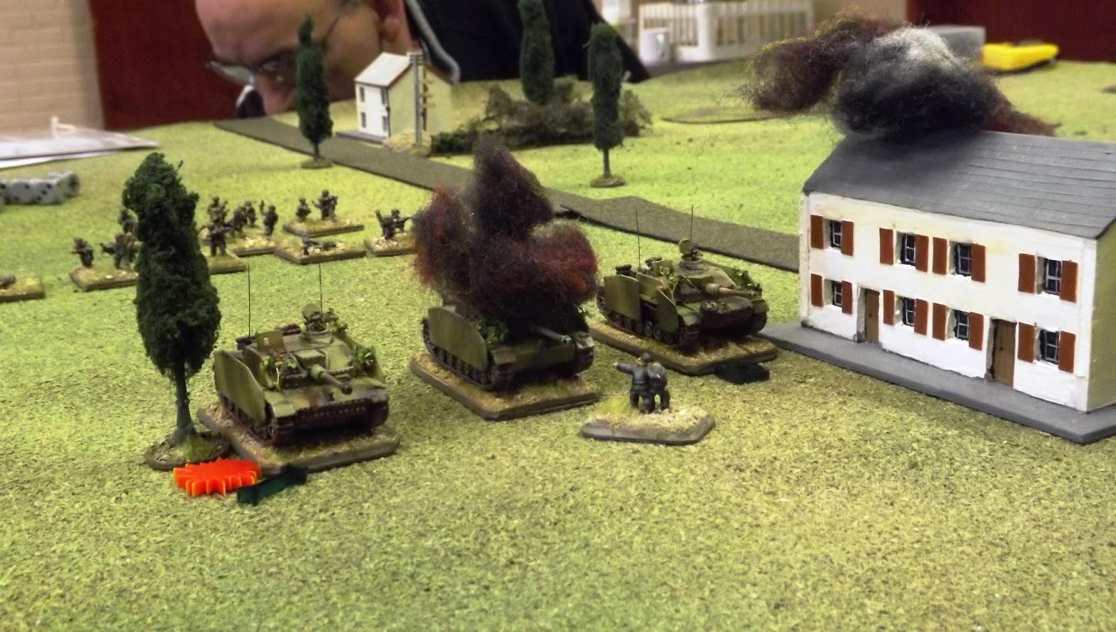 The StuGs feel the effect of the 6lbr with the one in the centre knocked out, the one on the left immobilised and shocked and the the right most vehicle with a damaged main gun.