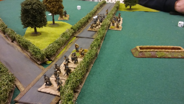 German return fire clears the trenches, and the advance continues.