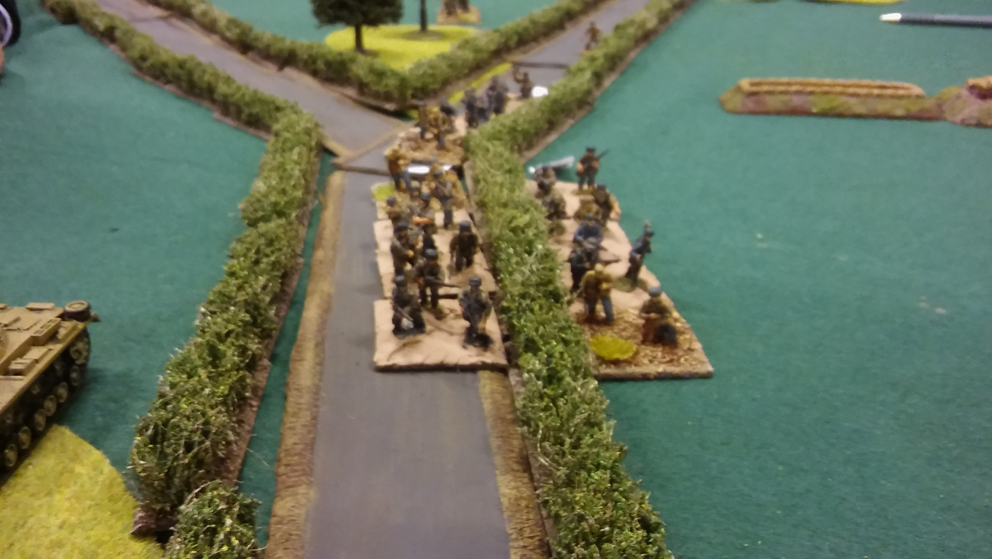 german advance down the road relentlessly carries on. drawing mg and mortar fire.