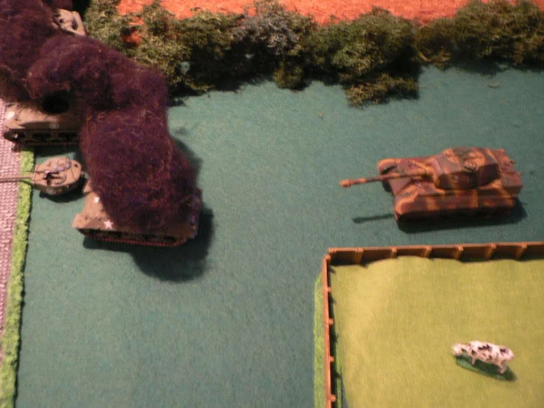 My Königstiger had finally gotten around the corner of the crop field and sent a Wolverine to the great scrapyard in the sky. The fight between the Tiger/Panther and the Shermans around the next corner was also going my way.