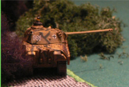 Up on the road the Panther starts firing in to the woods