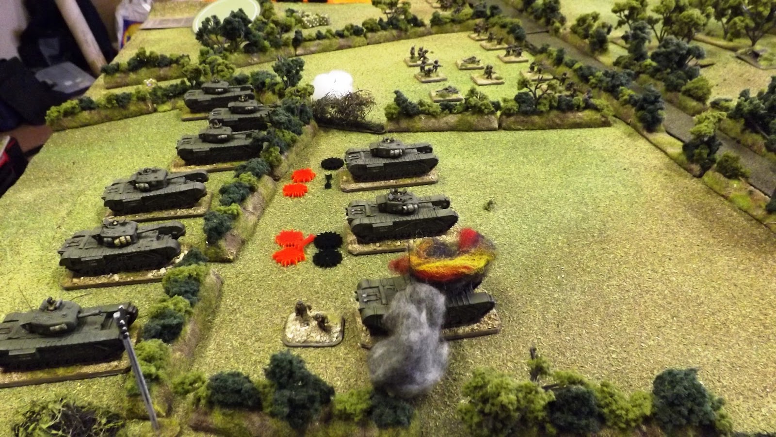 The lead British tanks take casualties, shock and damage as the Guards infantry sprint to the sunken lane