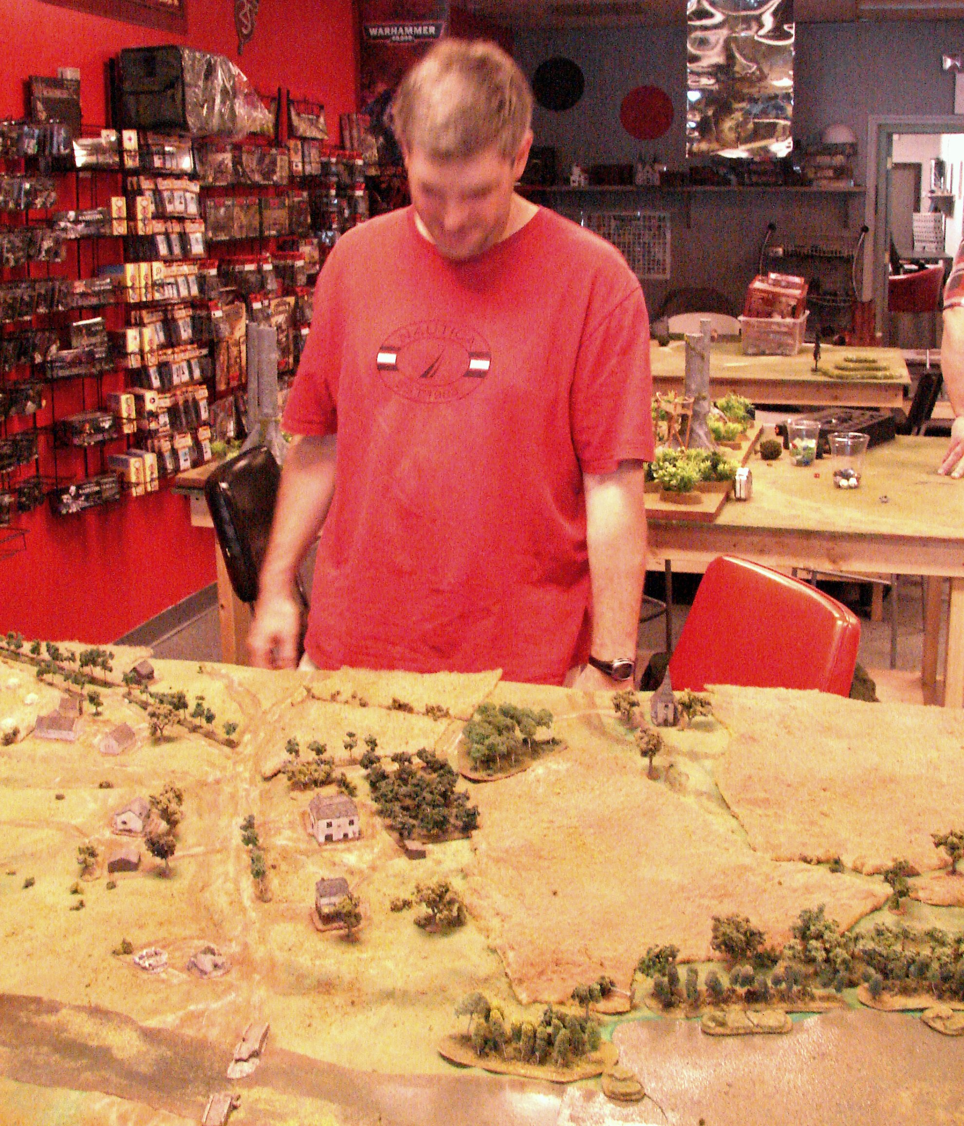 German commander attempts to blend into surroundings Chris uses his red shirt to fit into the decor as he carefully deploys his hidden defenders.