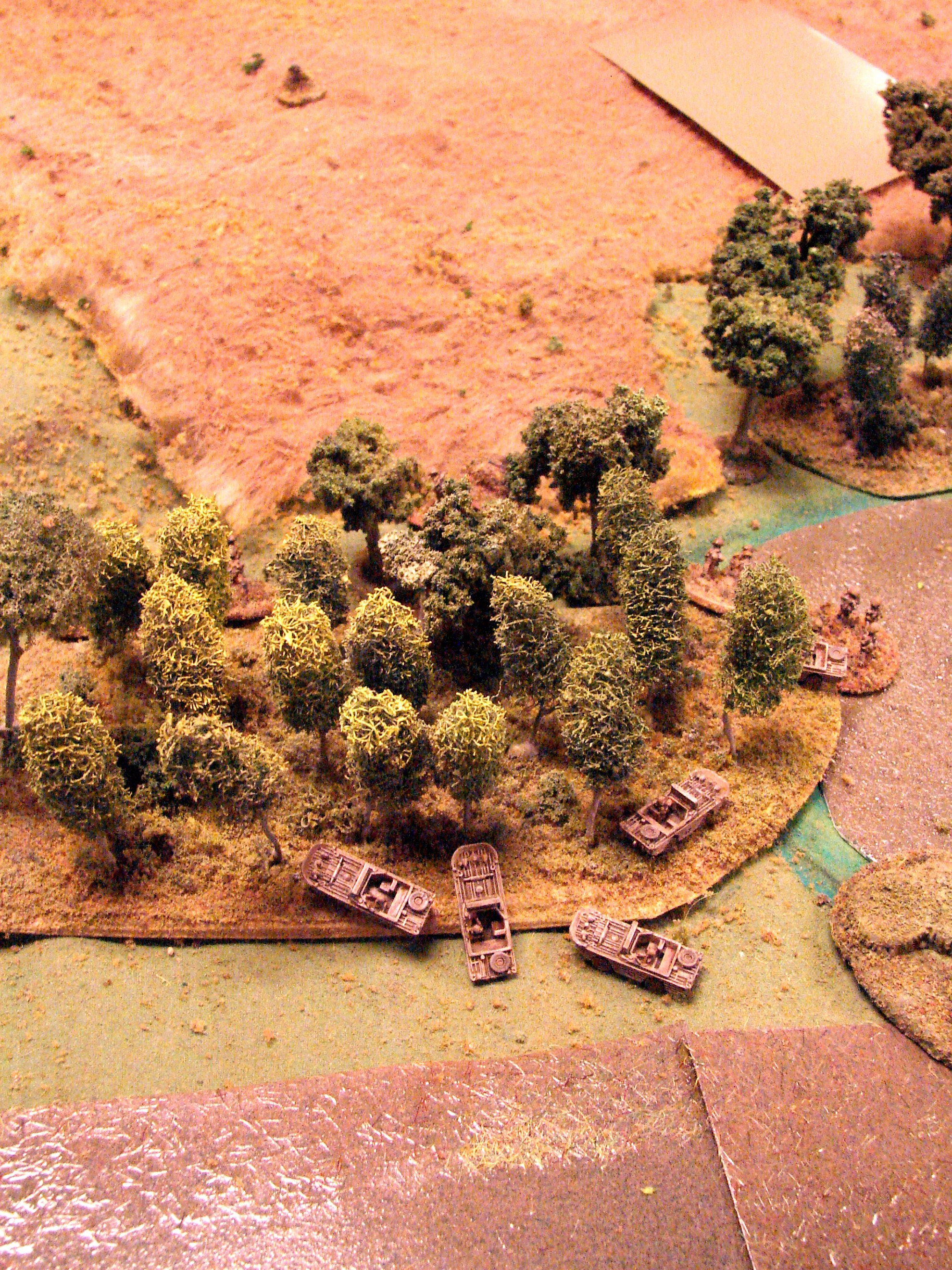 Peeping around The scouts cross the stream in their amphibious jeeps and move through the tree to engage the Pak 38 (and the German dummy blind to the right).