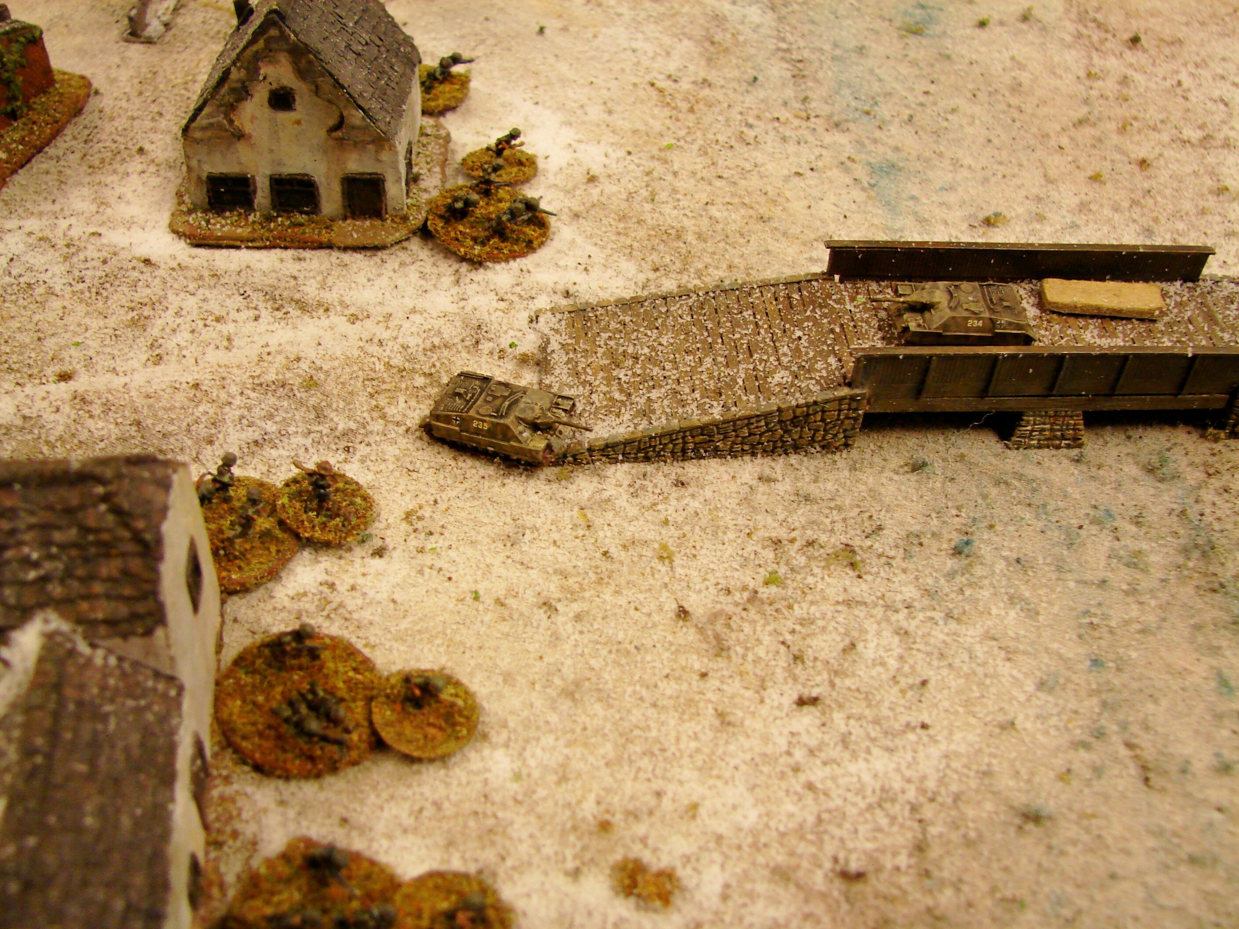 Last shots from Panzerjaeger The remaining panzerjaeger managed to get past its comrade on the bridge and fires a few shots at the advancing T34s before backing up to tow the broken down vehicle.