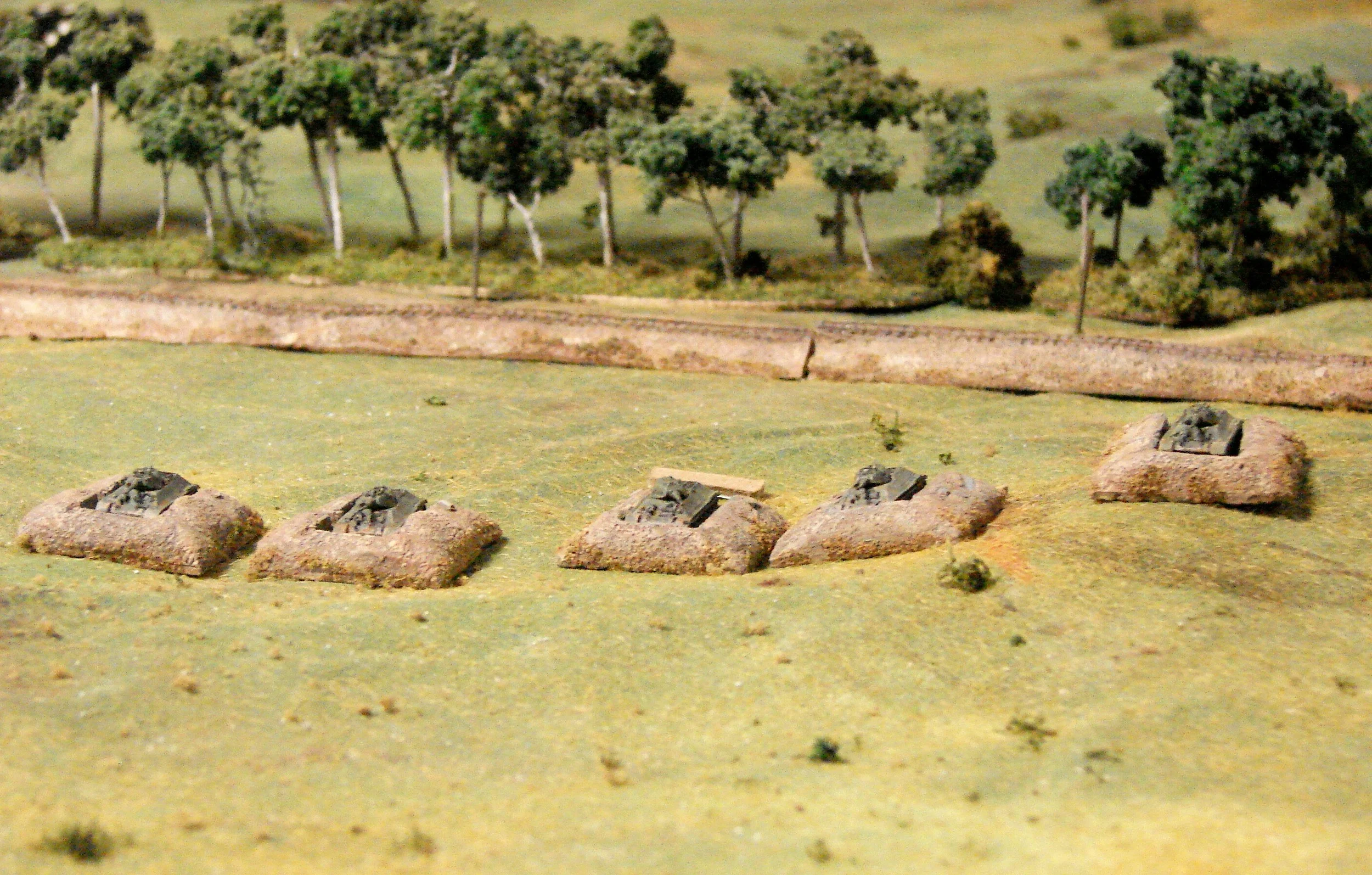 T34m1940 These are the CinC models in Timecast castings of tank dugouts. Probably too fancy for what was actually on the field. The Soviets couldn't go hull down due to training or turret construction, so these positions did help their defence.