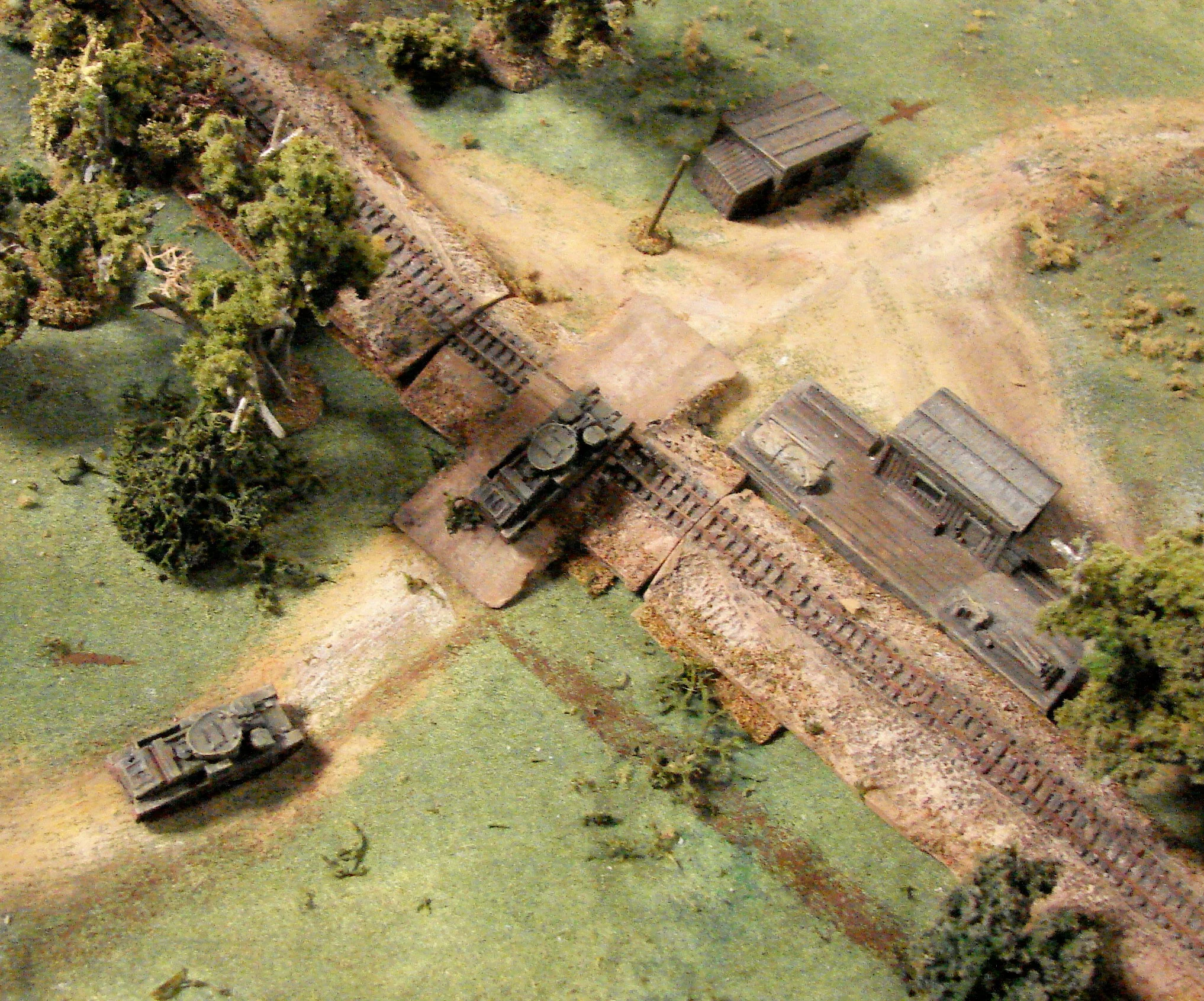 T28s crossing the tracks I was trying to get these behind the railroad (RR) to put some cover between them and the panzers. Only one made it.