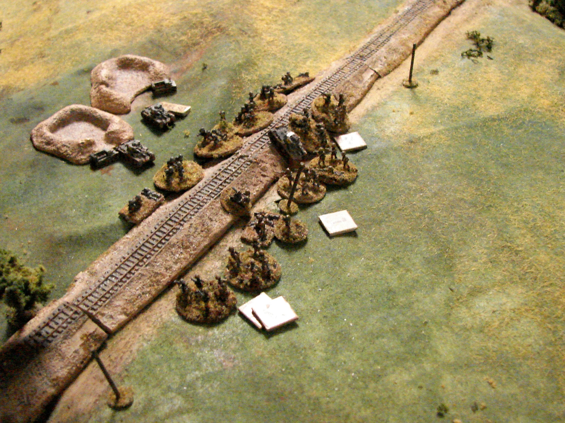 Grenadiers assault Two squads and the CO of the 6th Schutzen Co close assault the Soviets along the RR. Pretty uneven fight since the Reds are already chewed up by the Pz38t MGs.