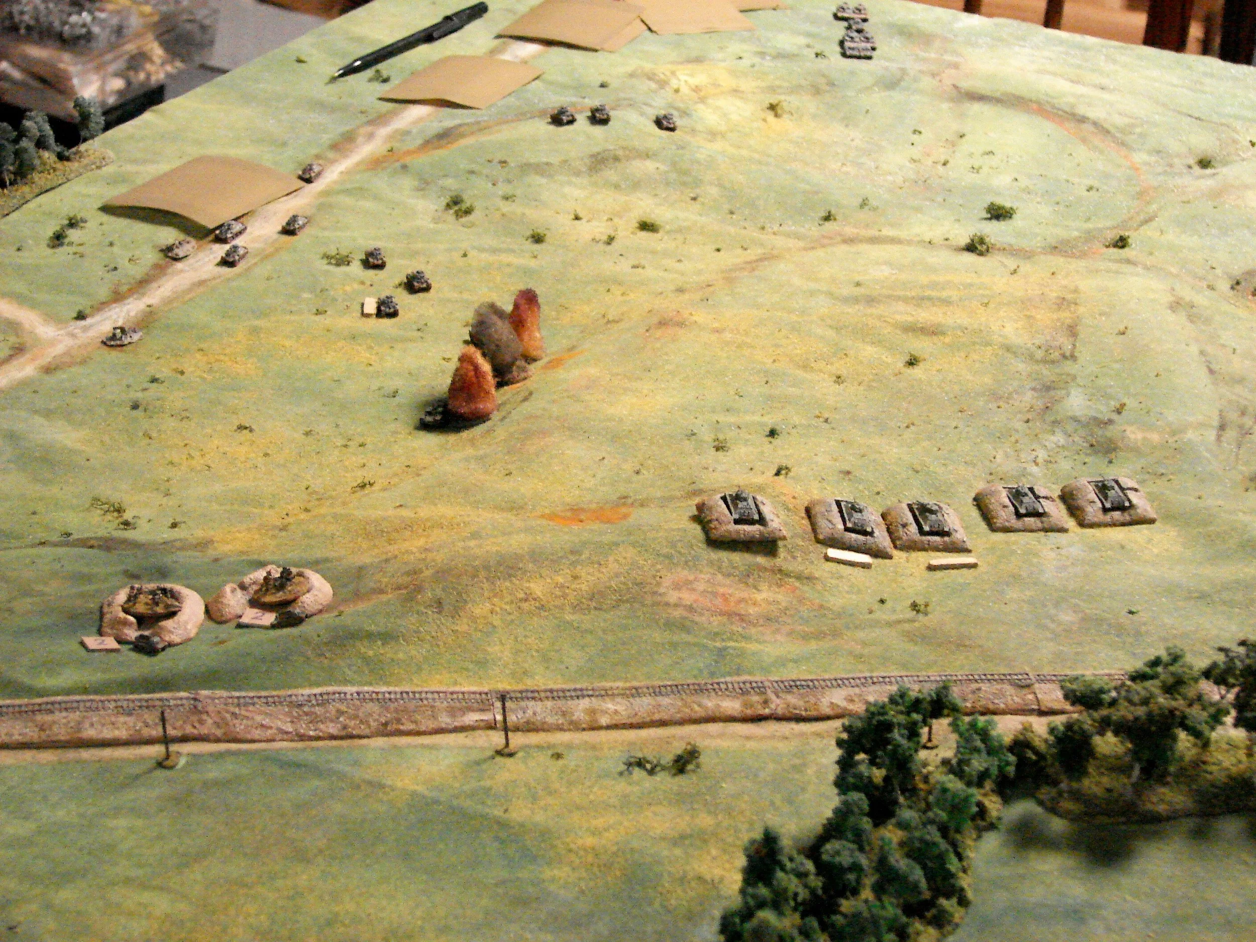 German advance This shows the table edge where the Germans had to appear. The Nemen river would be off board behind some woods. The Blinds are the follow on units of PzIVs, PzIIs, truck mounted infantry, and a couple of dummy blinds.
