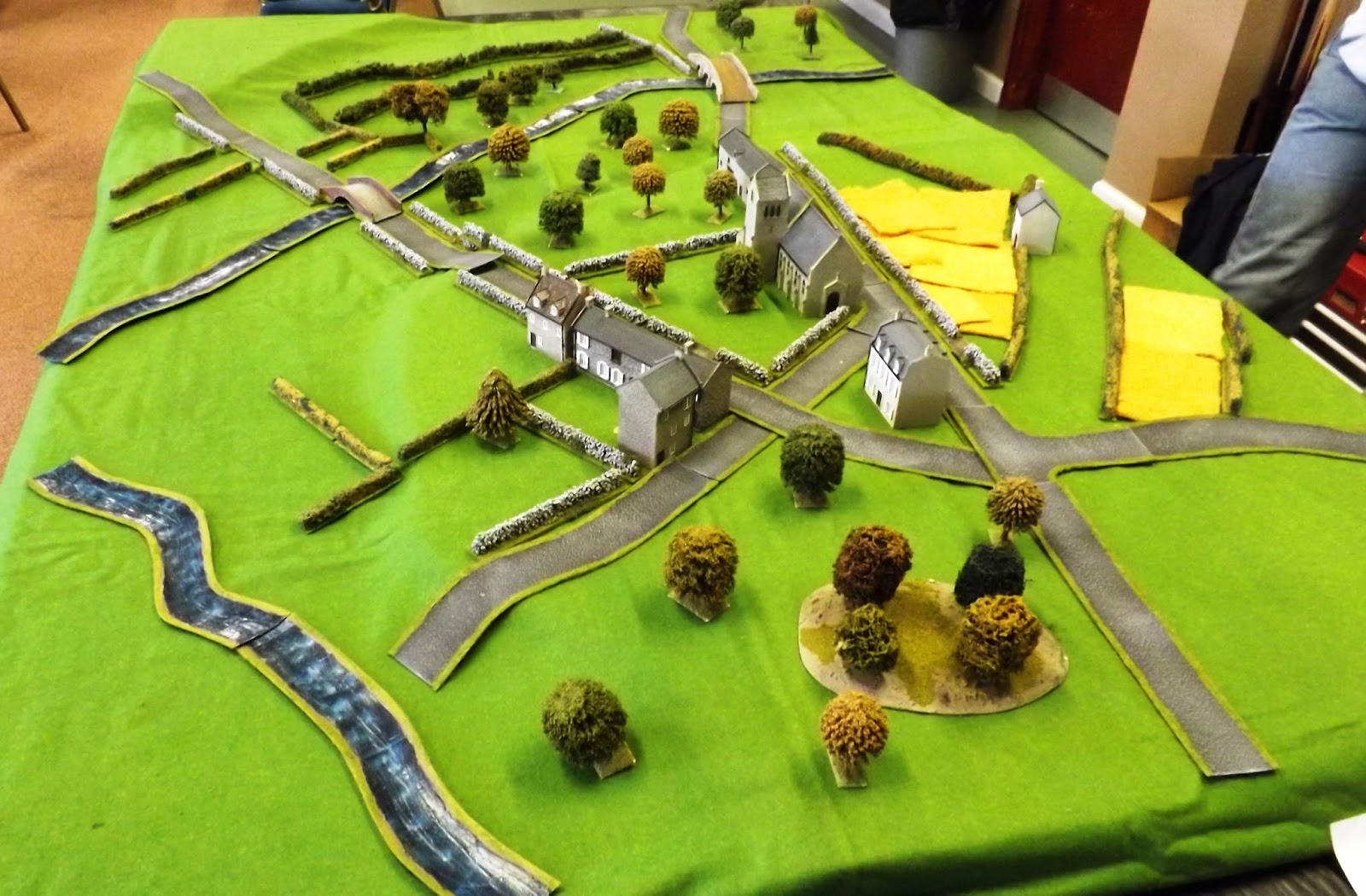 The table top interpretation of the map, left, with the Canadian entry road top right