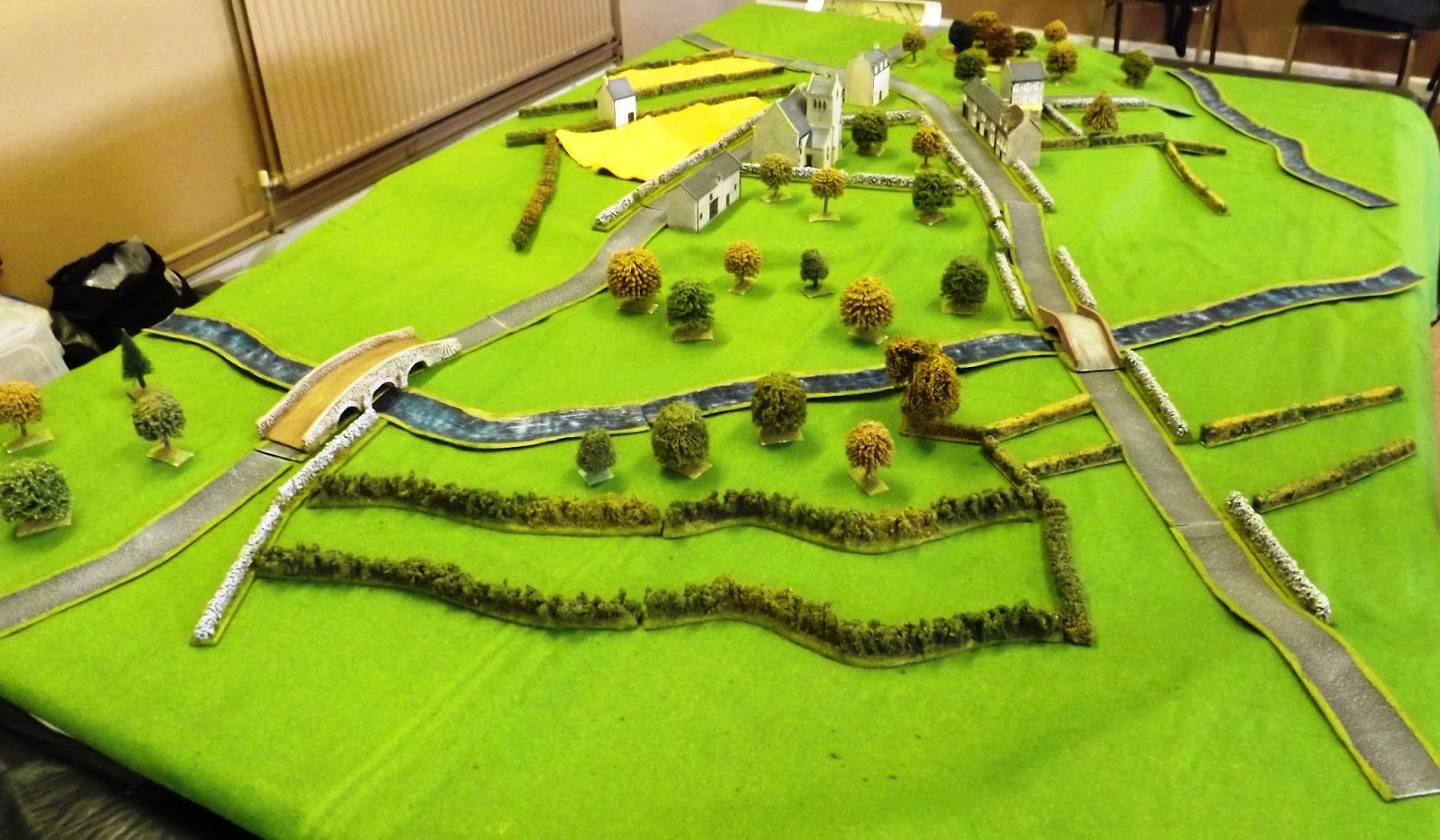 The view of the village from the Canadian edge with the stream to their front, a likely bogging obstacle to tanks not using the bridges