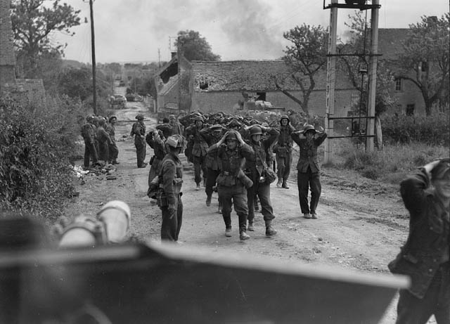 German troops surrendered in St Lambert. The German soldier extreme right, grinning, looks particularly pleased to be out of the war