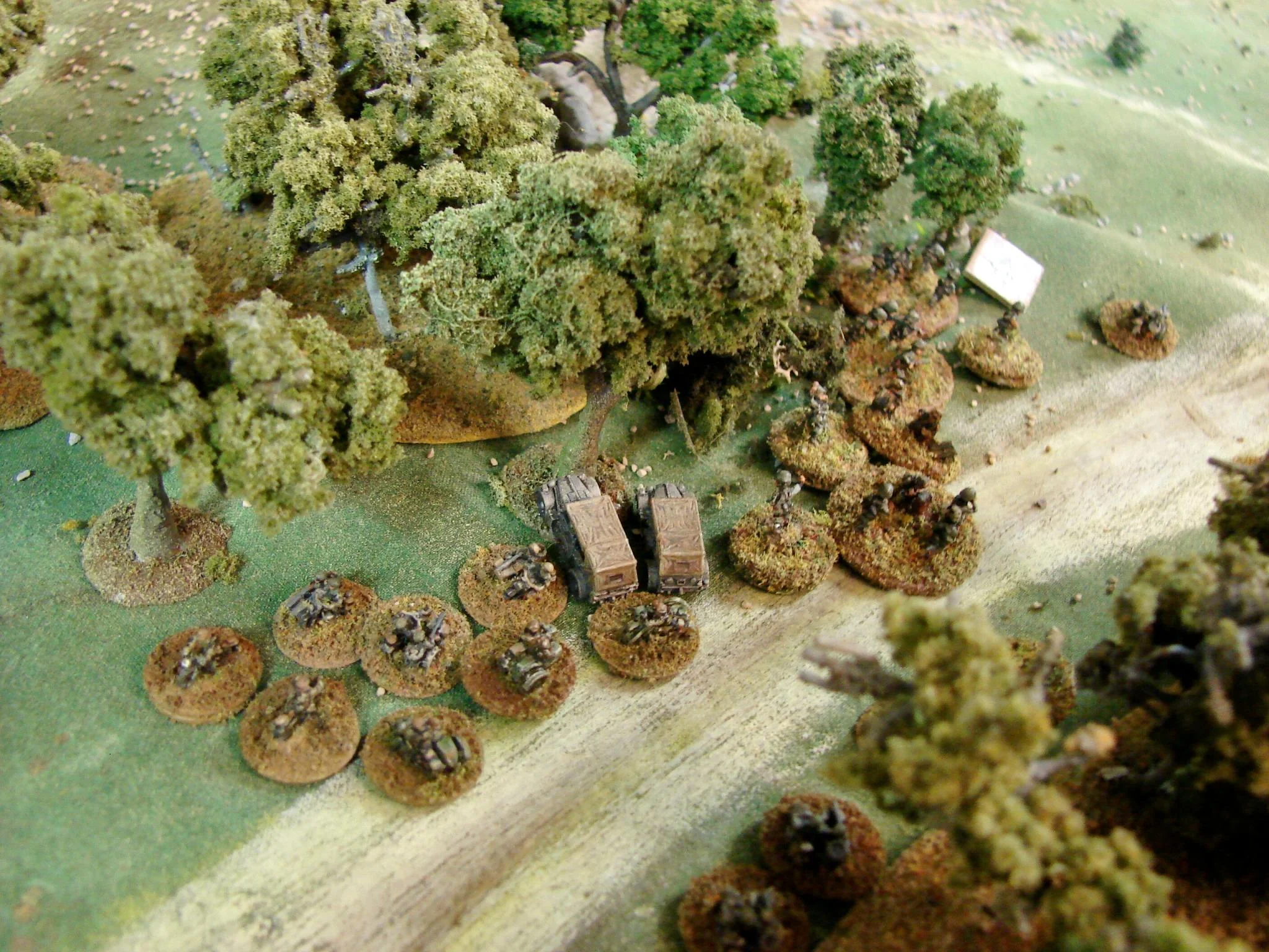 The Company HQ unit arrives It looks like the motorcycle troops are pinned down by the LMGs of the armoured cars and fire from the engineers' Bren guns. Without anything to make the NZ armoured cars fall back, the Germans are waiting for some reinforcements.